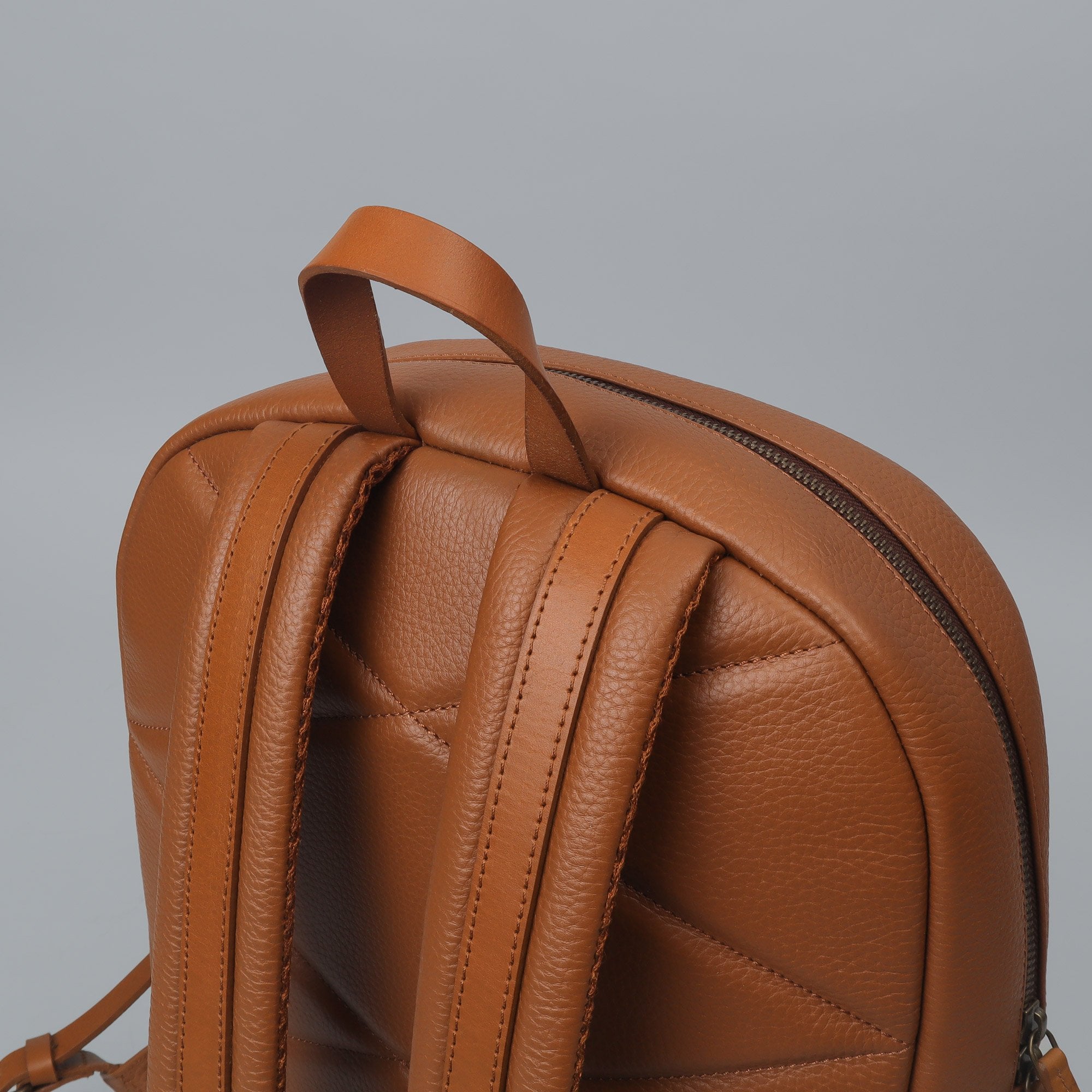 Alabama Leather Backpack made from premium full grain leather, featuring multiple pockets and adjustable padded straps, ideal for everyday use.