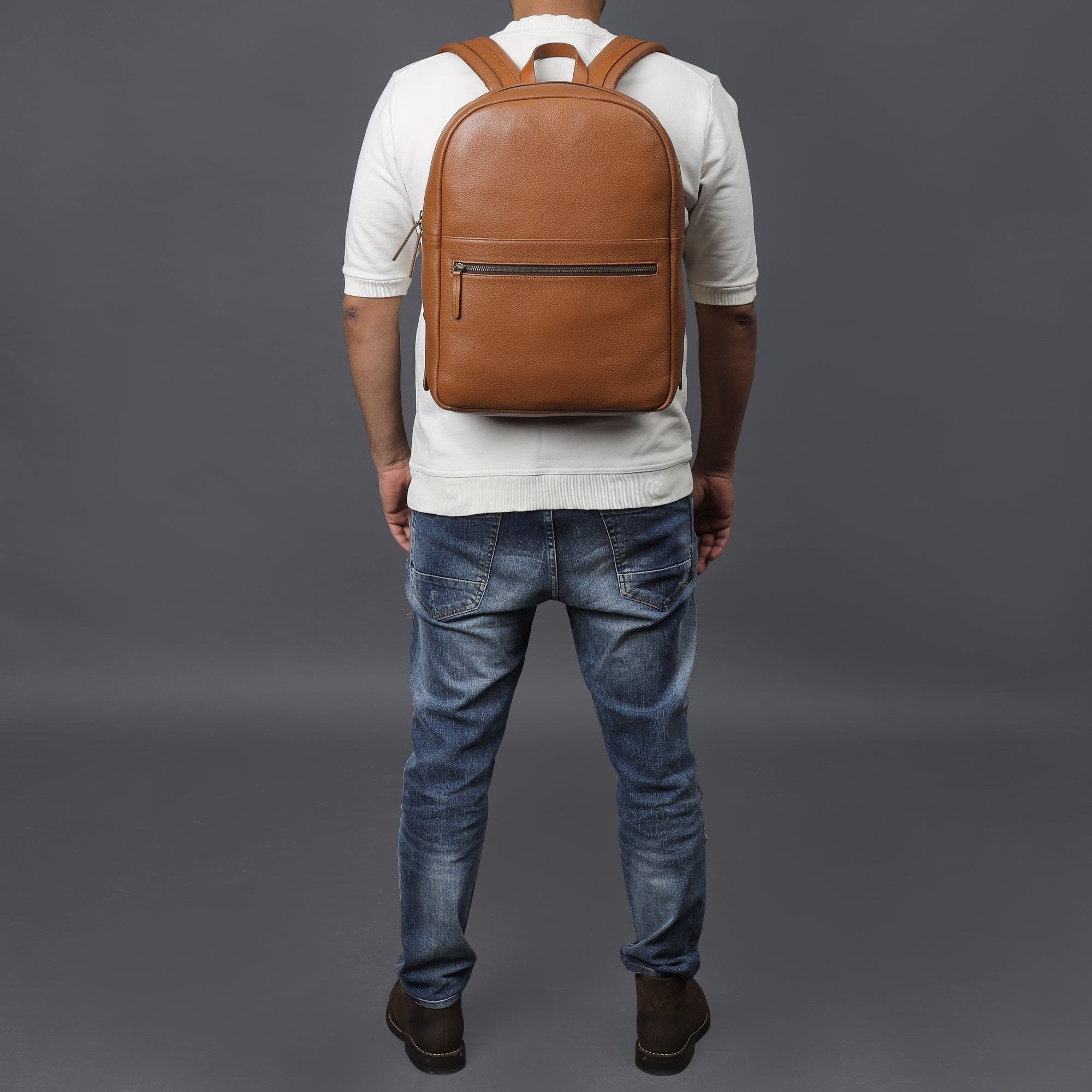 Alabama Leather Backpack made from premium full grain leather, featuring multiple pockets and adjustable padded straps, ideal for everyday use.