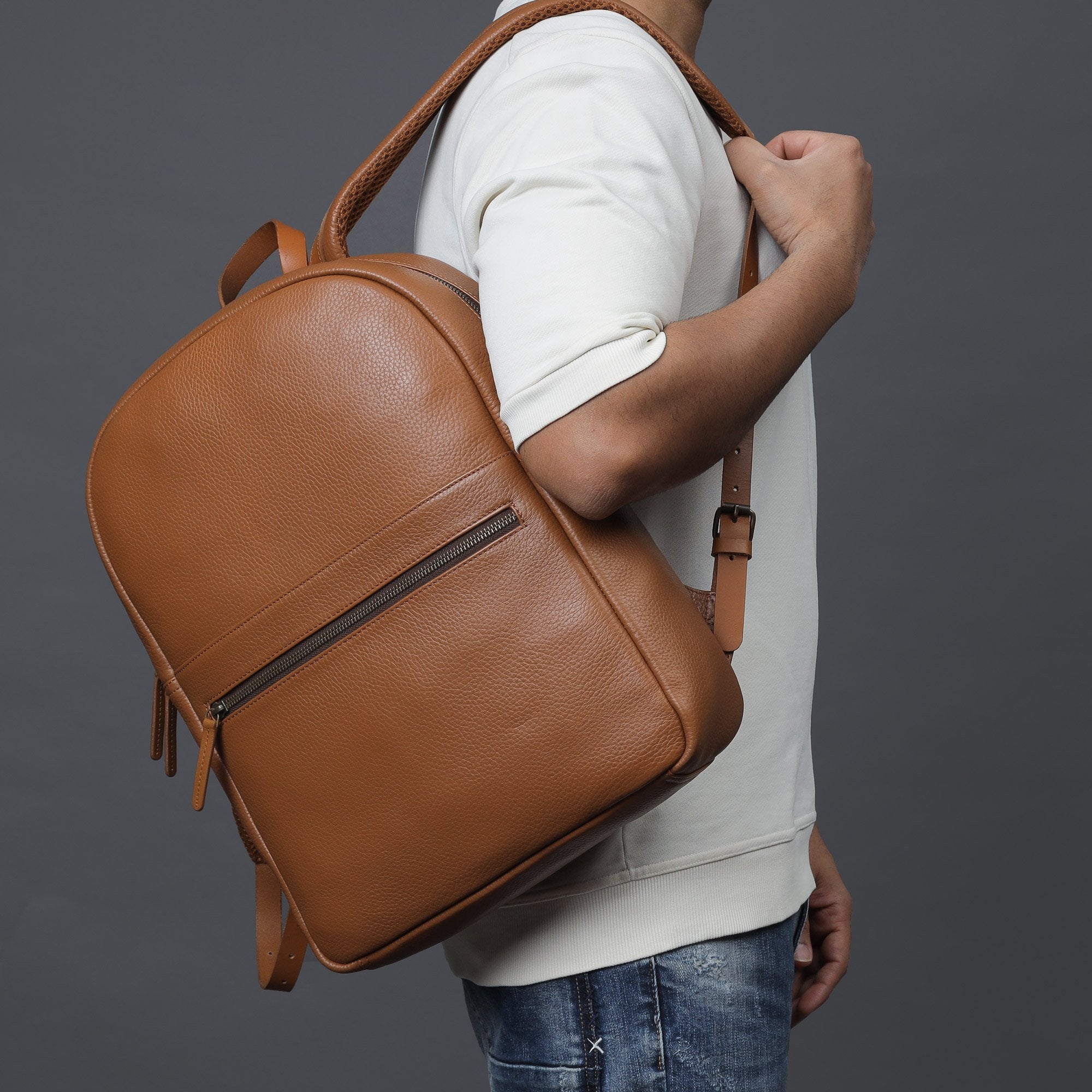 Alabama Leather Backpack made from premium full grain leather, featuring multiple pockets and adjustable padded straps, ideal for everyday use.