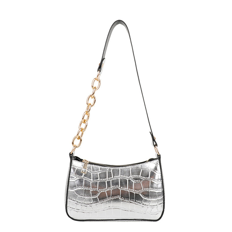 Alligator pattern lady's chain shoulder bag in medium size with a zipper closure and single strap.