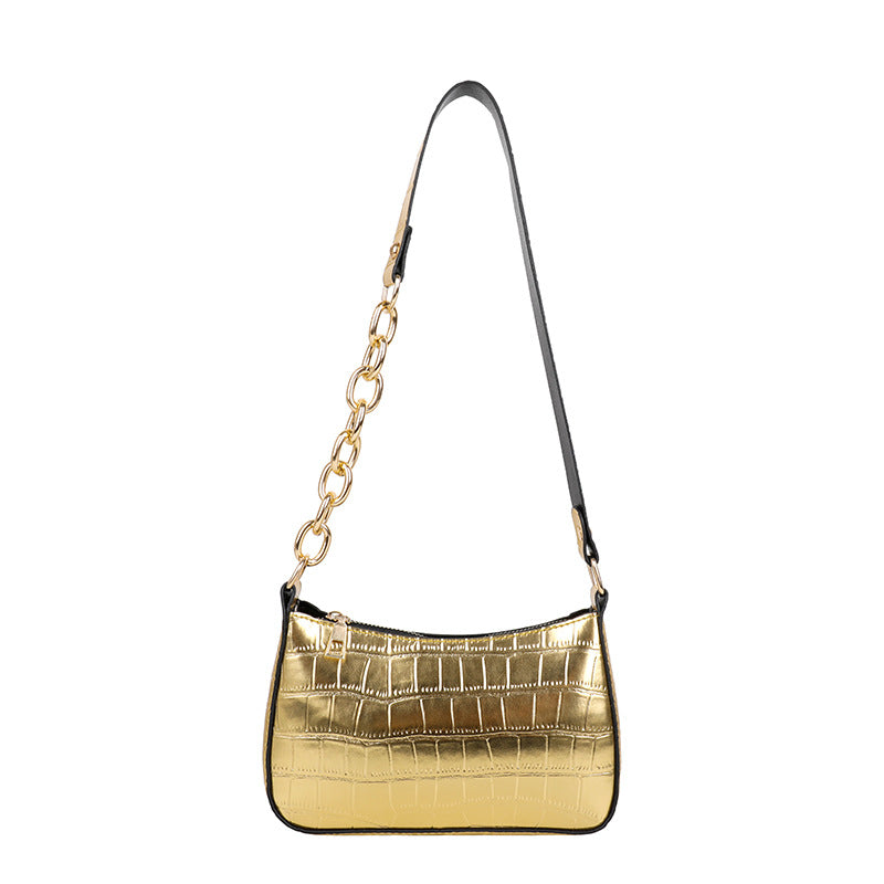 Alligator pattern lady's chain shoulder bag in medium size with a zipper closure and single strap.