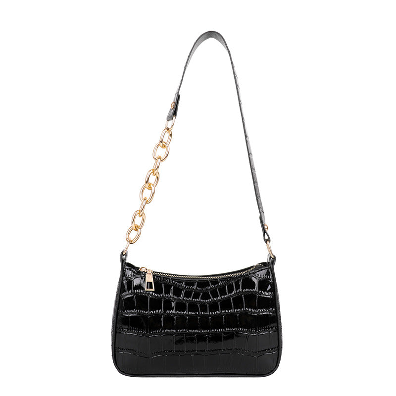 Alligator pattern lady's chain shoulder bag in medium size with a zipper closure and single strap.