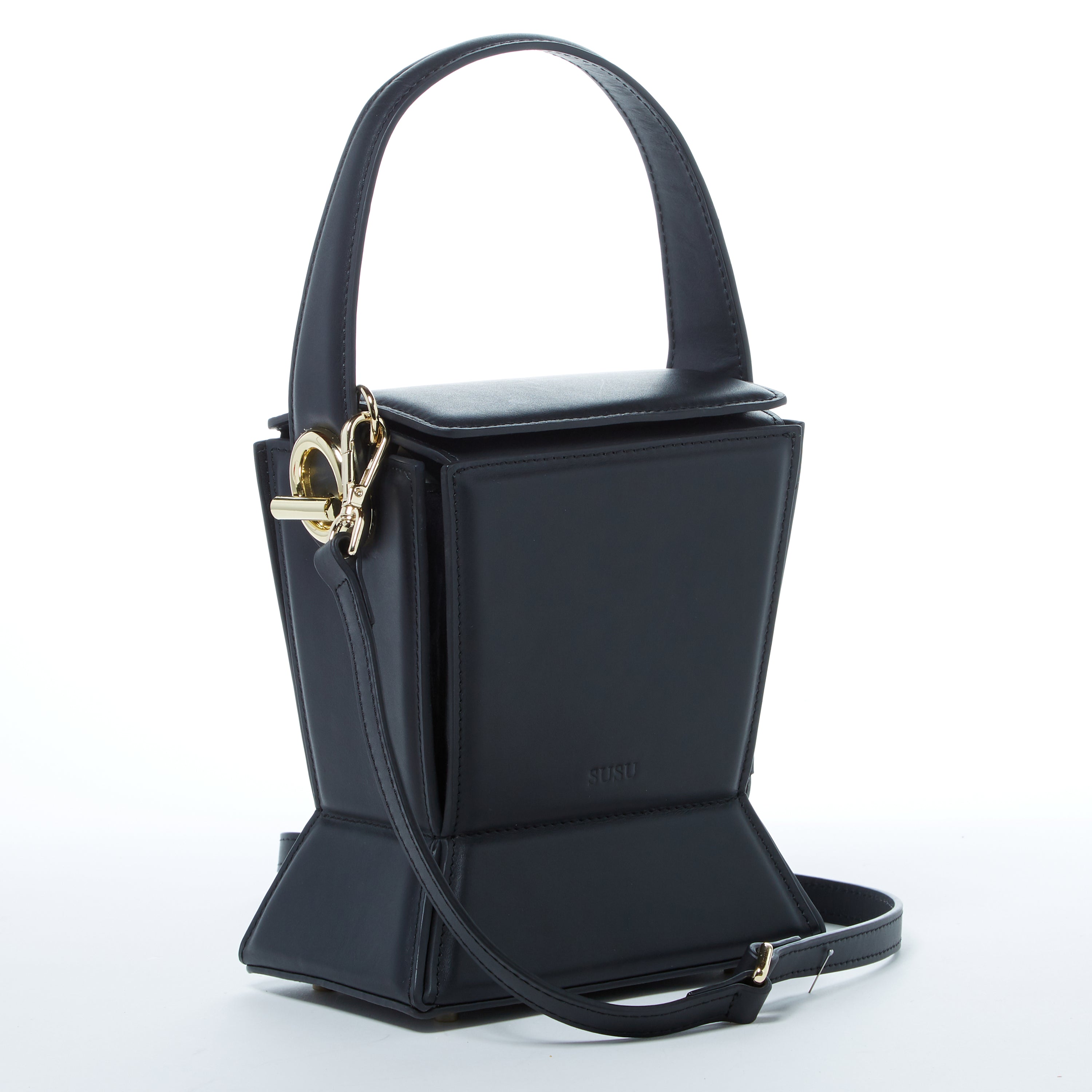 Amber Leather Bucket Purse in black with geometric design, gold hardware, and coffee cotton lining, showcasing its stylish and functional features.