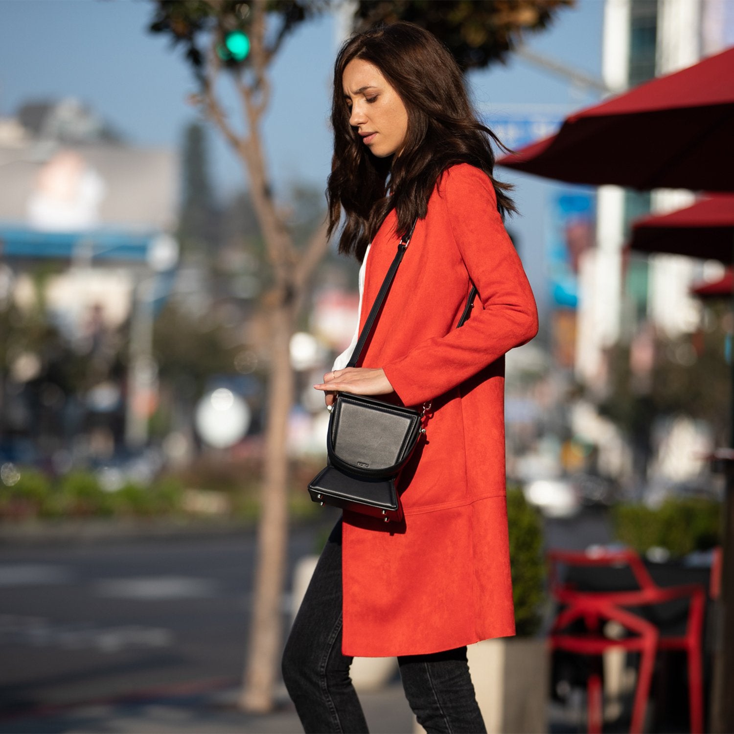 Amber Leather Bucket Purse in black with geometric design, gold hardware, and coffee cotton lining, showcasing its stylish and functional features.