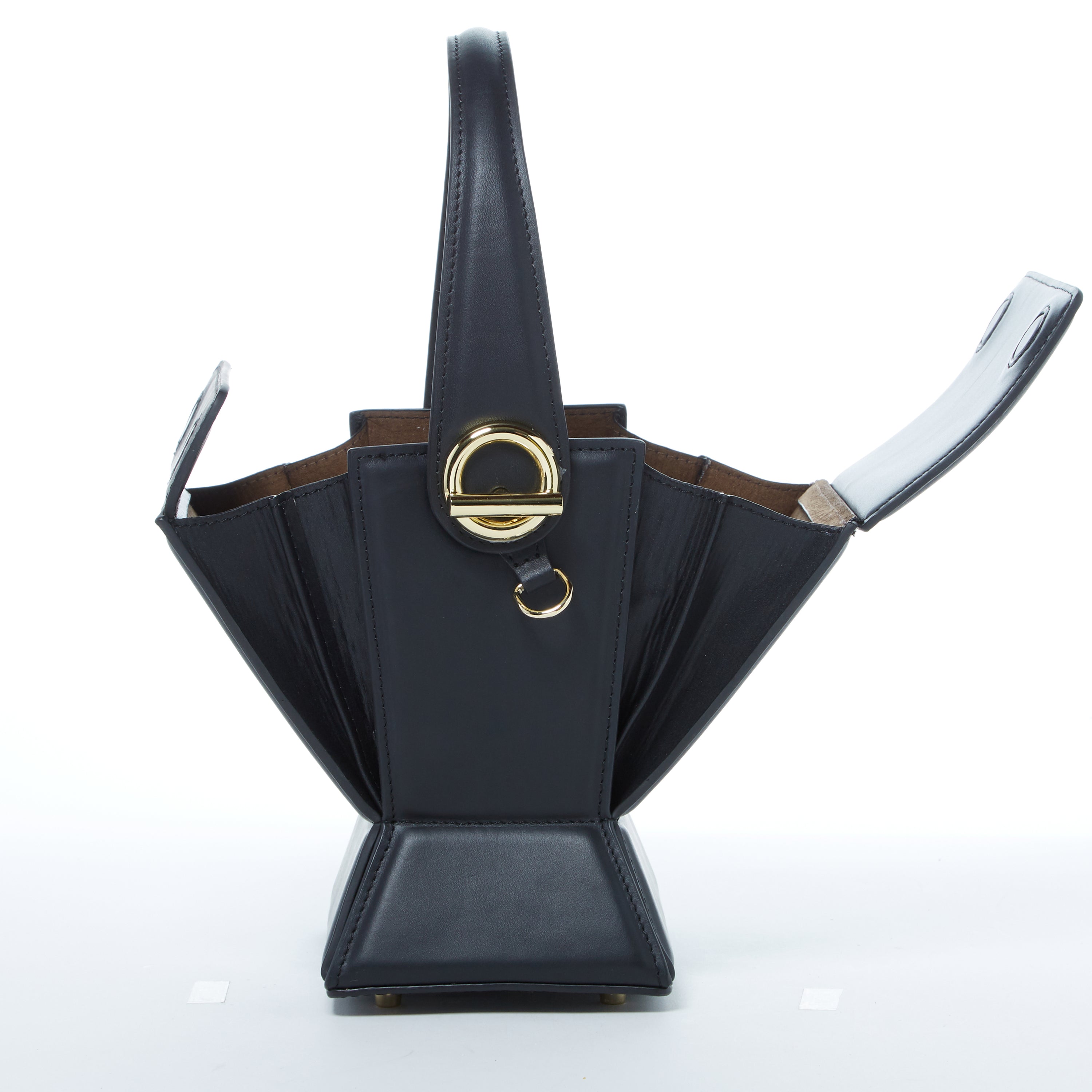 Amber Leather Bucket Purse in black with geometric design, gold hardware, and coffee cotton lining, showcasing its stylish and functional features.