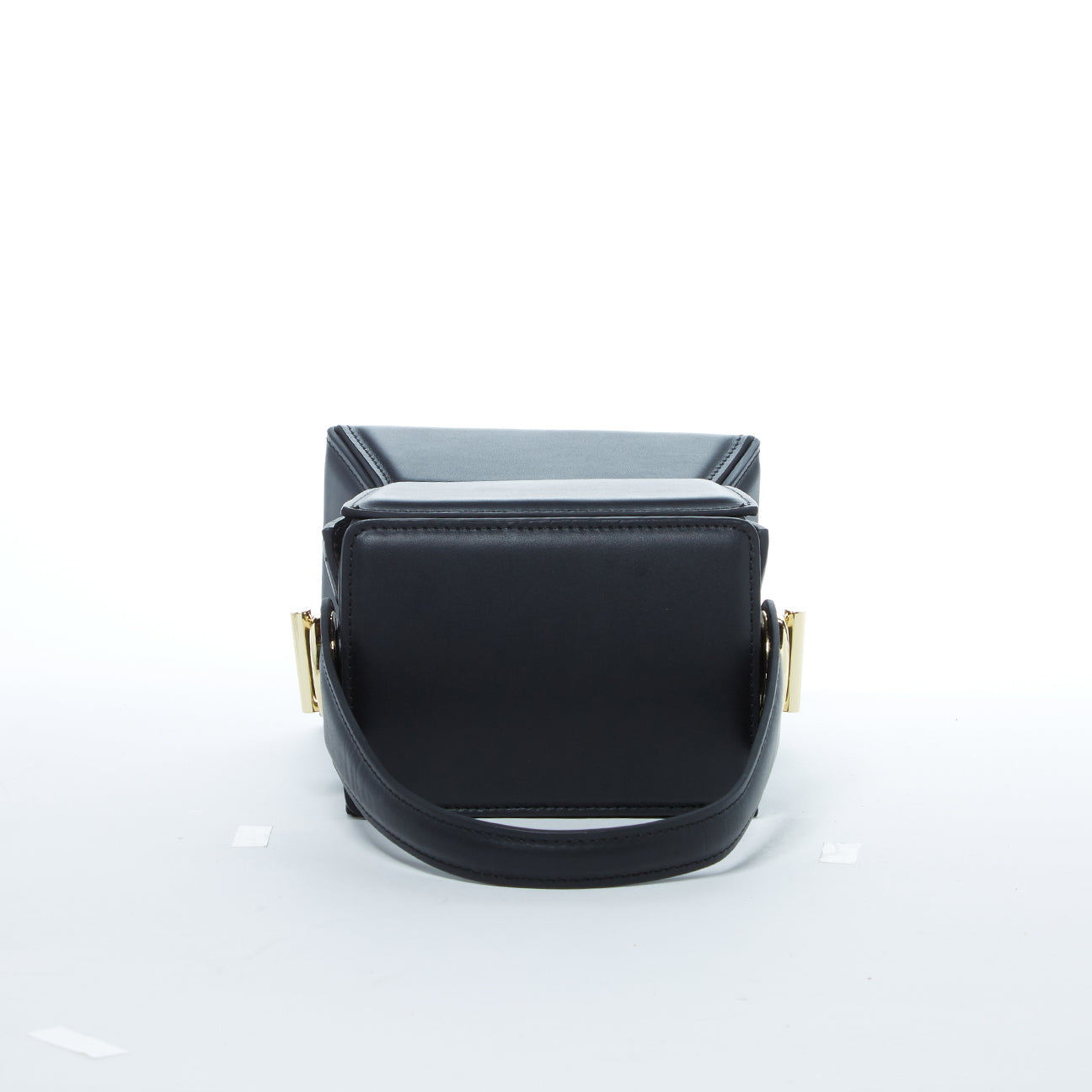 Amber Leather Bucket Purse in black with geometric design, gold hardware, and coffee cotton lining, showcasing its stylish and functional features.