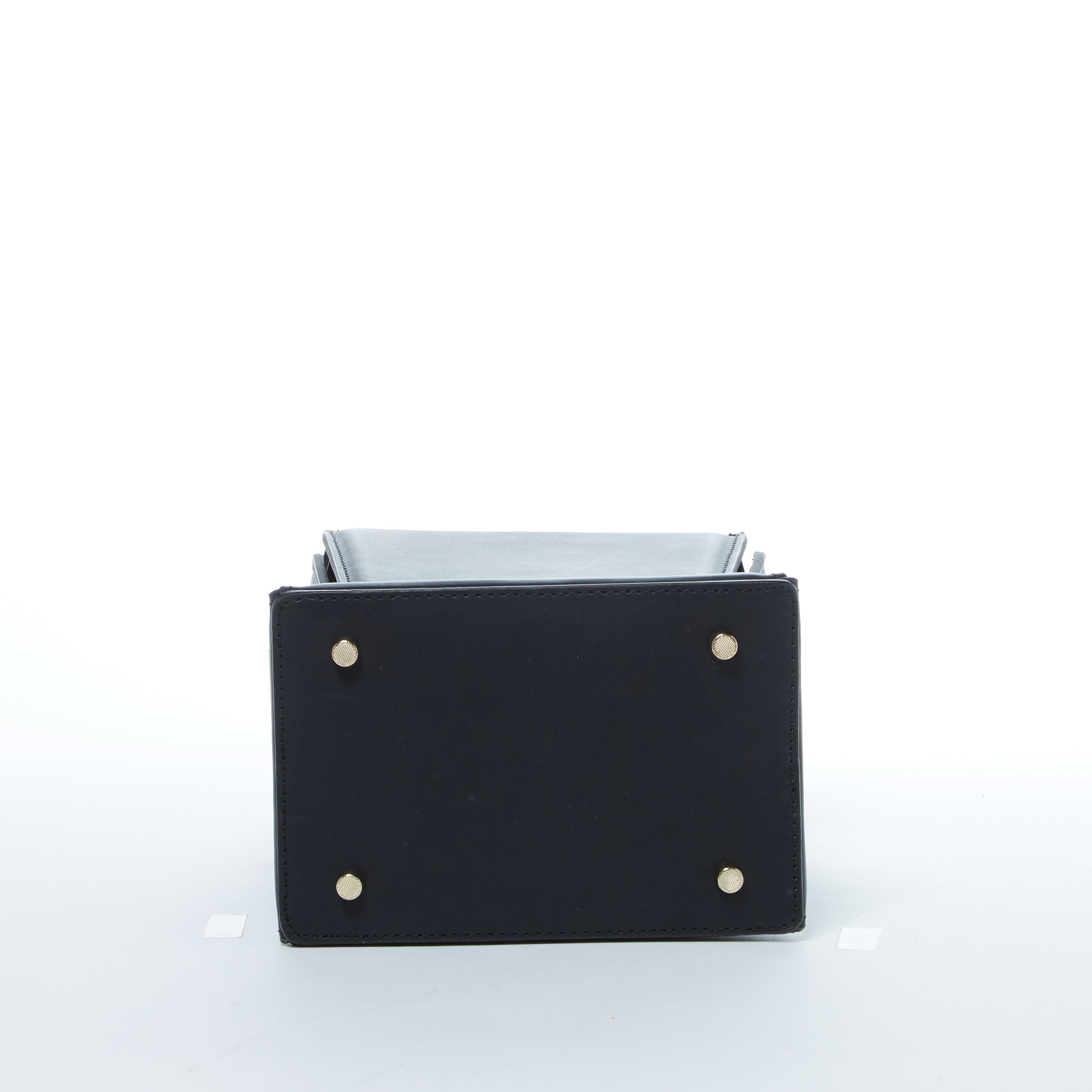 Amber Leather Bucket Purse in black with geometric design, gold hardware, and coffee cotton lining, showcasing its stylish and functional features.