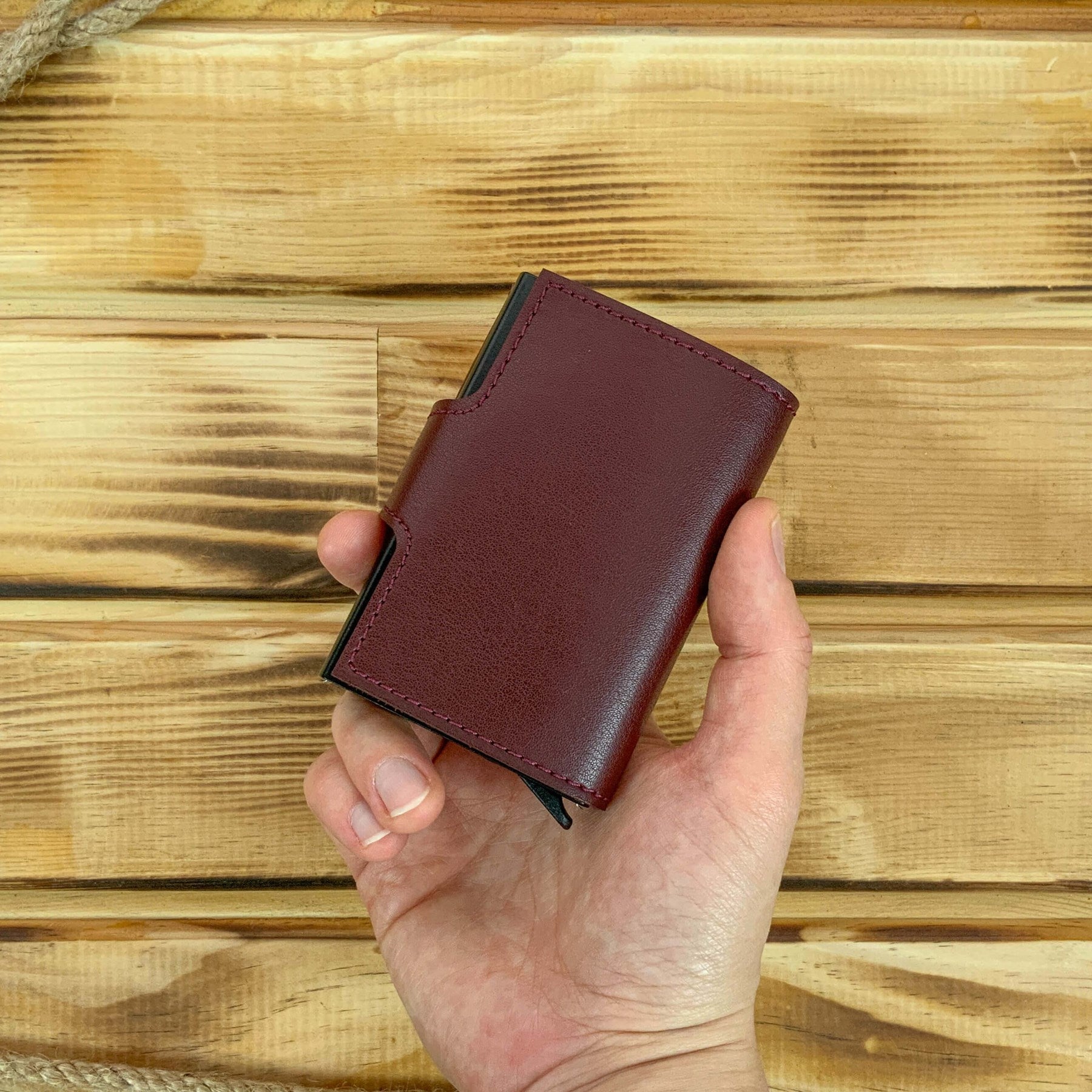 Angora Vegan Leather RFID Mechanism Card Holder in burgundy, navy, and black, showcasing its sleek design and pop-up card feature.