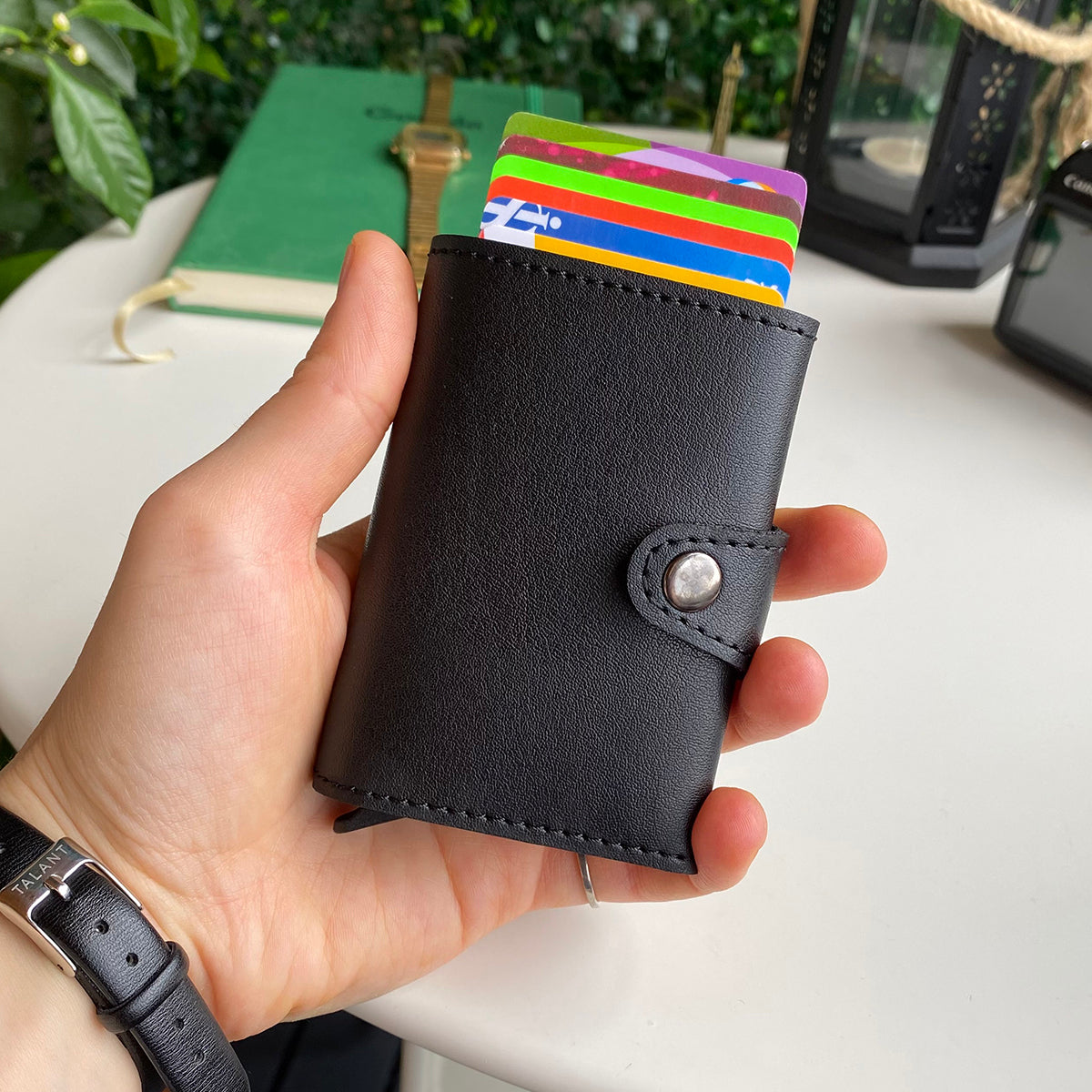 Angora Vegan Leather RFID Mechanism Card Holder in burgundy, navy, and black, showcasing its sleek design and pop-up card feature.