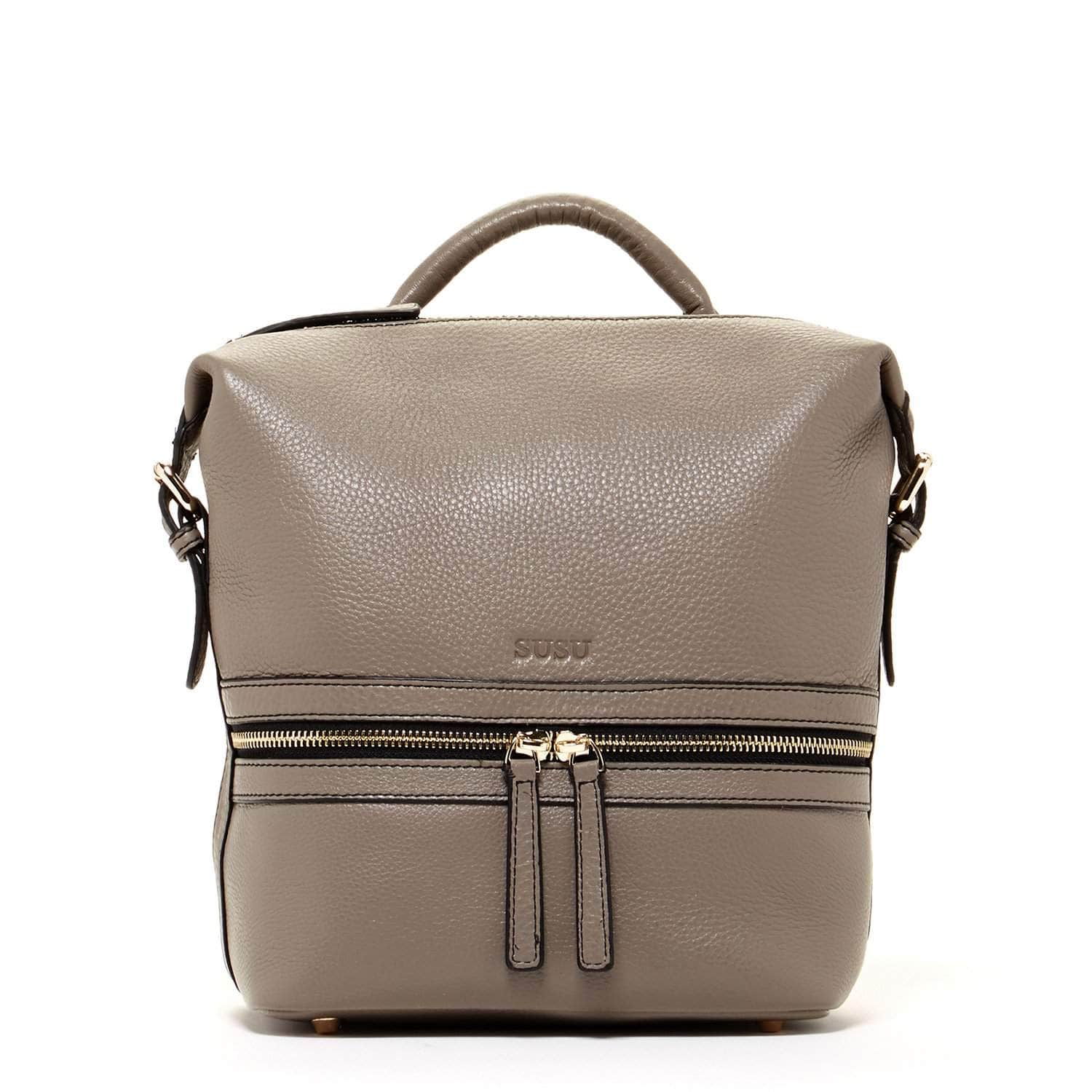 Ashley Gray Leather Backpack Purse featuring genuine pebble leather, silver zippers, and turquoise interior, showcasing its stylish and versatile design.