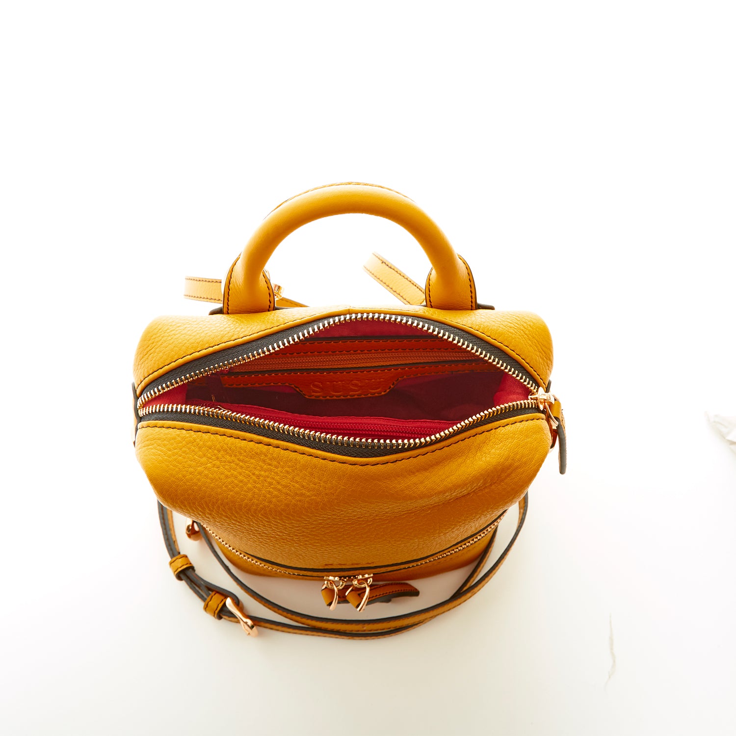 Ashley Small Yellow Leather Backpack featuring genuine pebble leather, gold zippers, and stylish tassels.