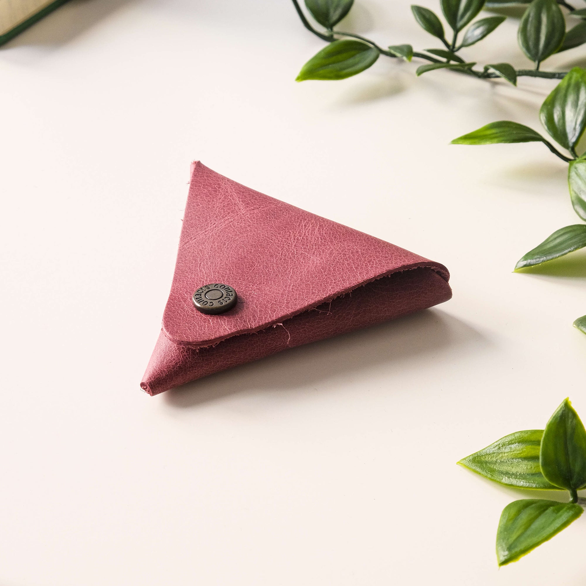 Bamby Genuine Leather Coin Pouch in various colors, showcasing its minimalist and stitchless design.