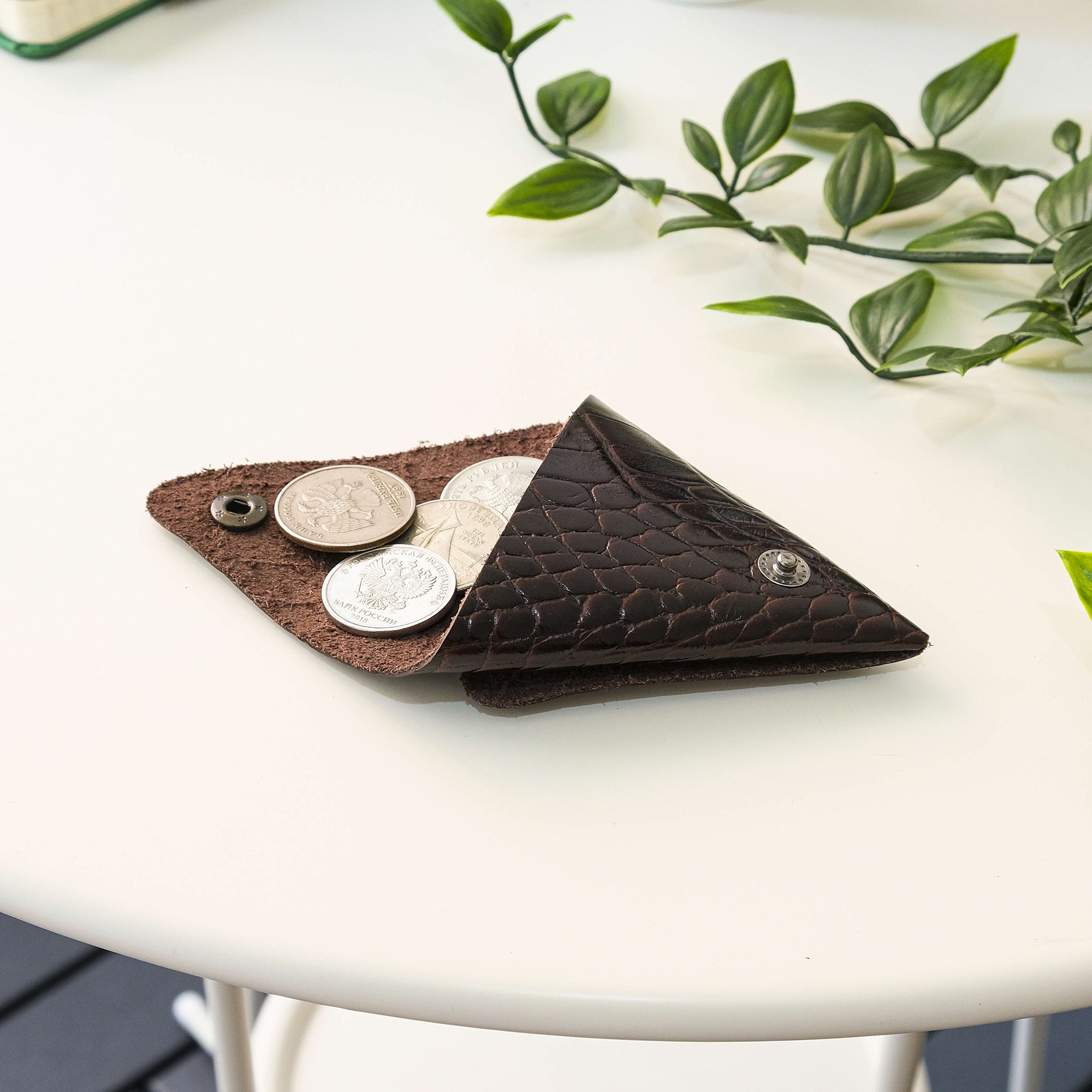 Bamby Genuine Leather Coin Pouch in various colors, showcasing its minimalist and stitchless design.