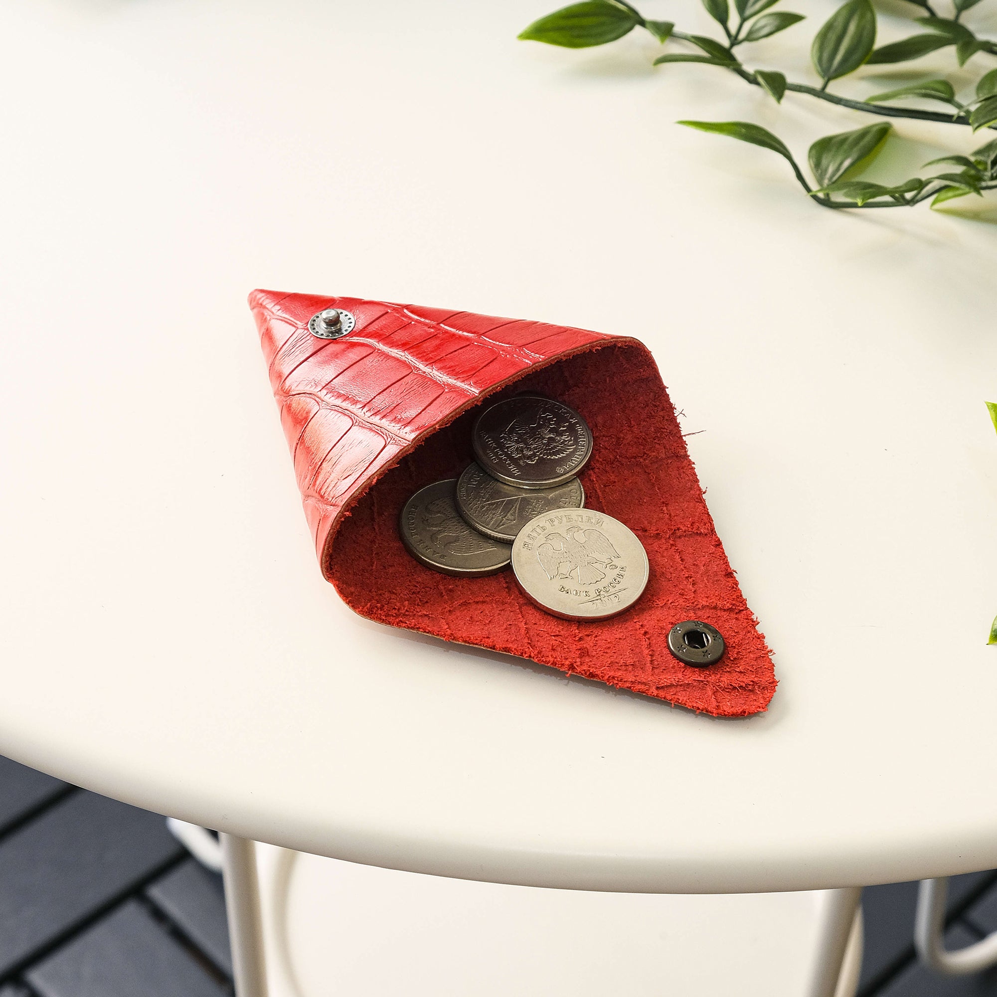 Bamby Genuine Leather Coin Pouch in various colors, showcasing its minimalist and stitchless design.