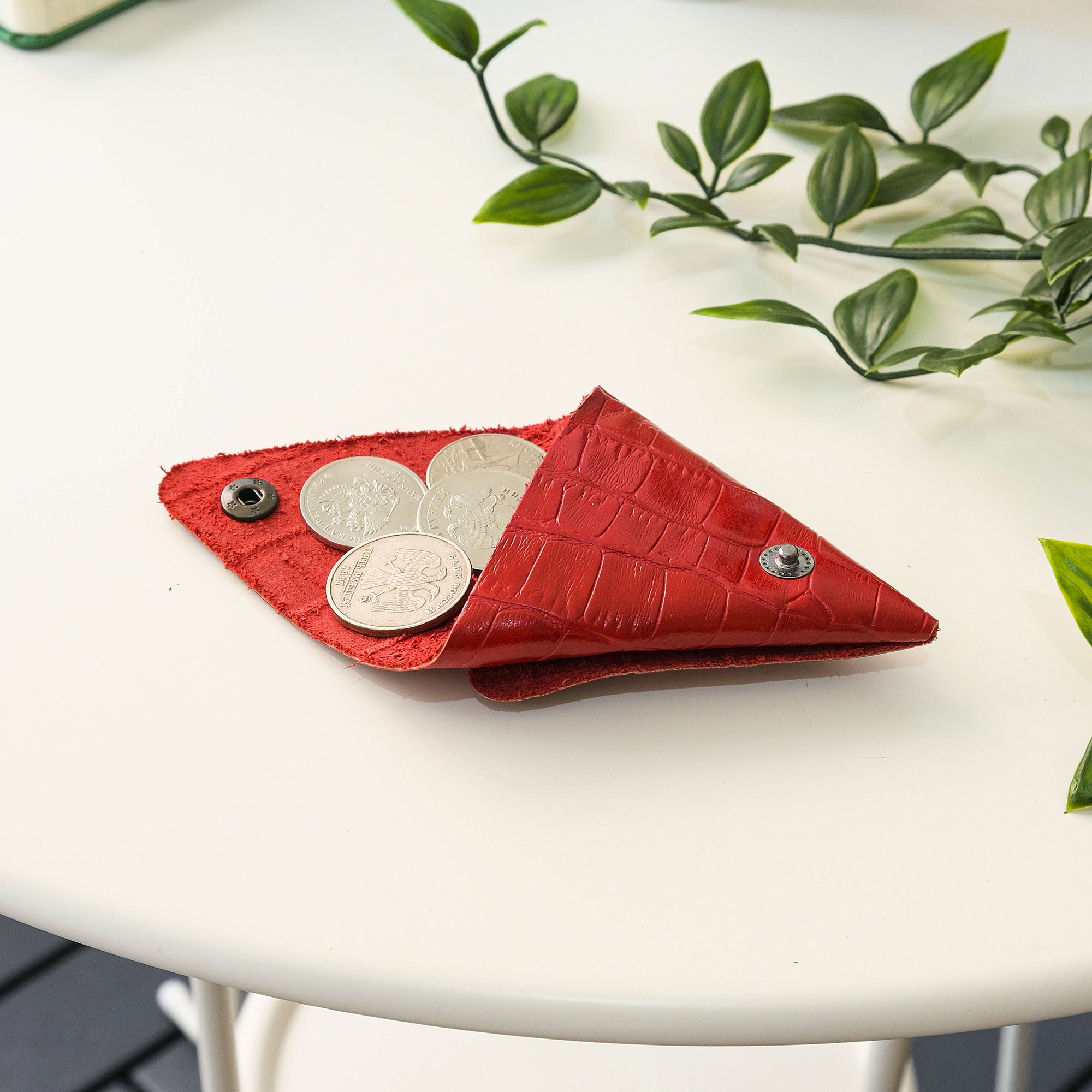 Bamby Genuine Leather Coin Pouch in various colors, showcasing its minimalist and stitchless design.