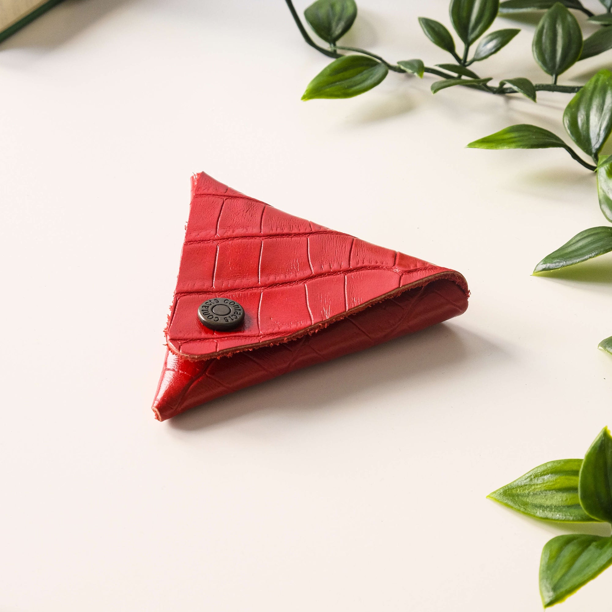 Bamby Genuine Leather Coin Pouch in various colors, showcasing its minimalist and stitchless design.