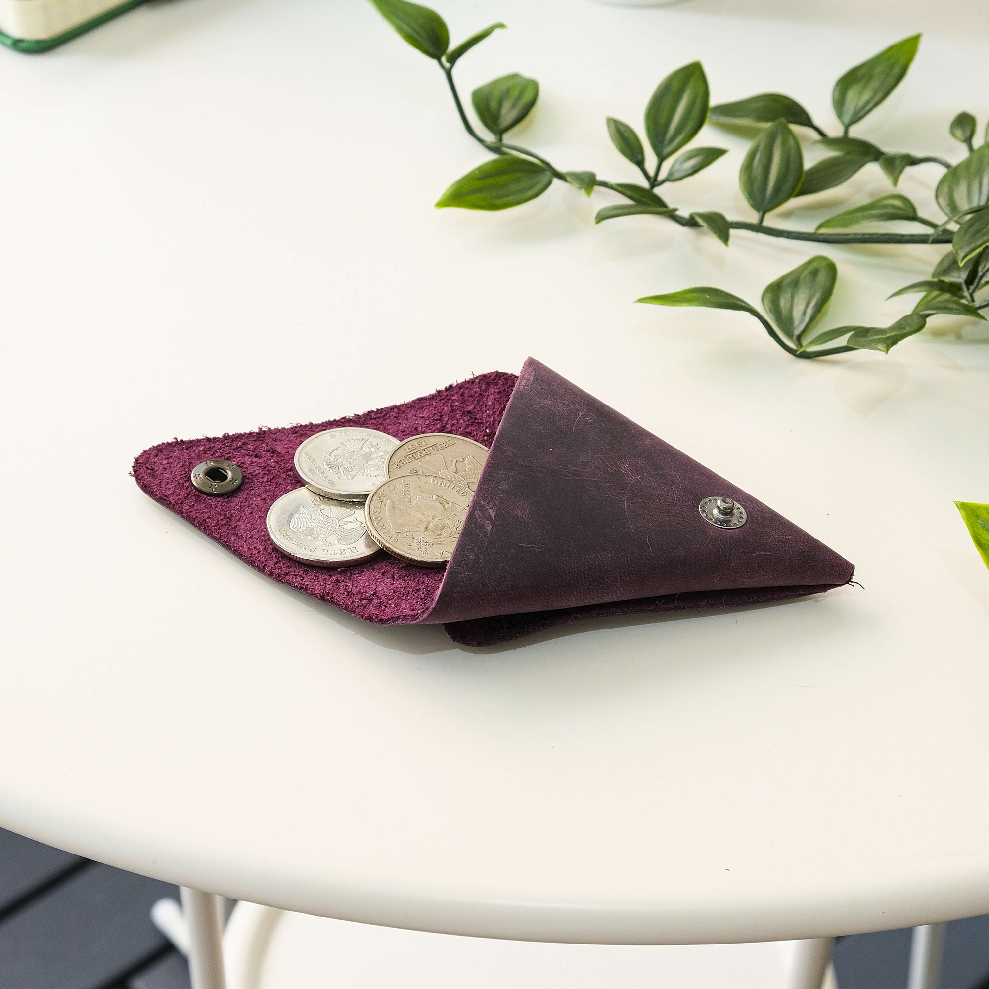 Bamby Genuine Leather Coin Pouch in various colors, showcasing its minimalist and stitchless design.