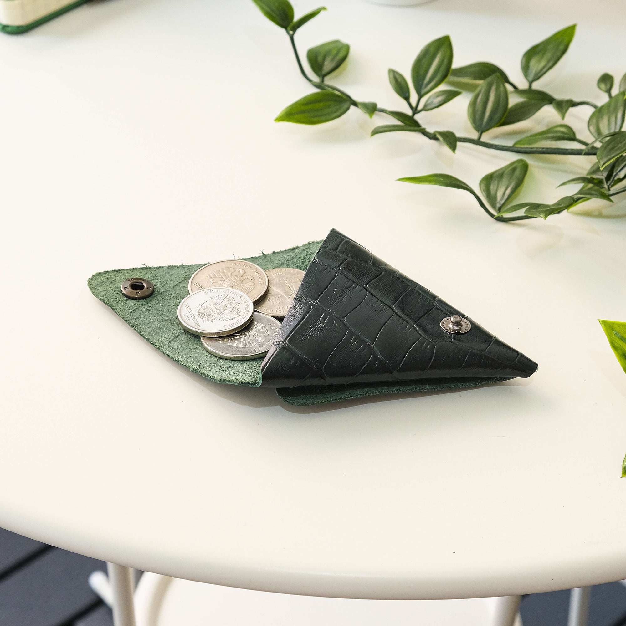 Bamby Genuine Leather Coin Pouch in various colors, showcasing its minimalist and stitchless design.