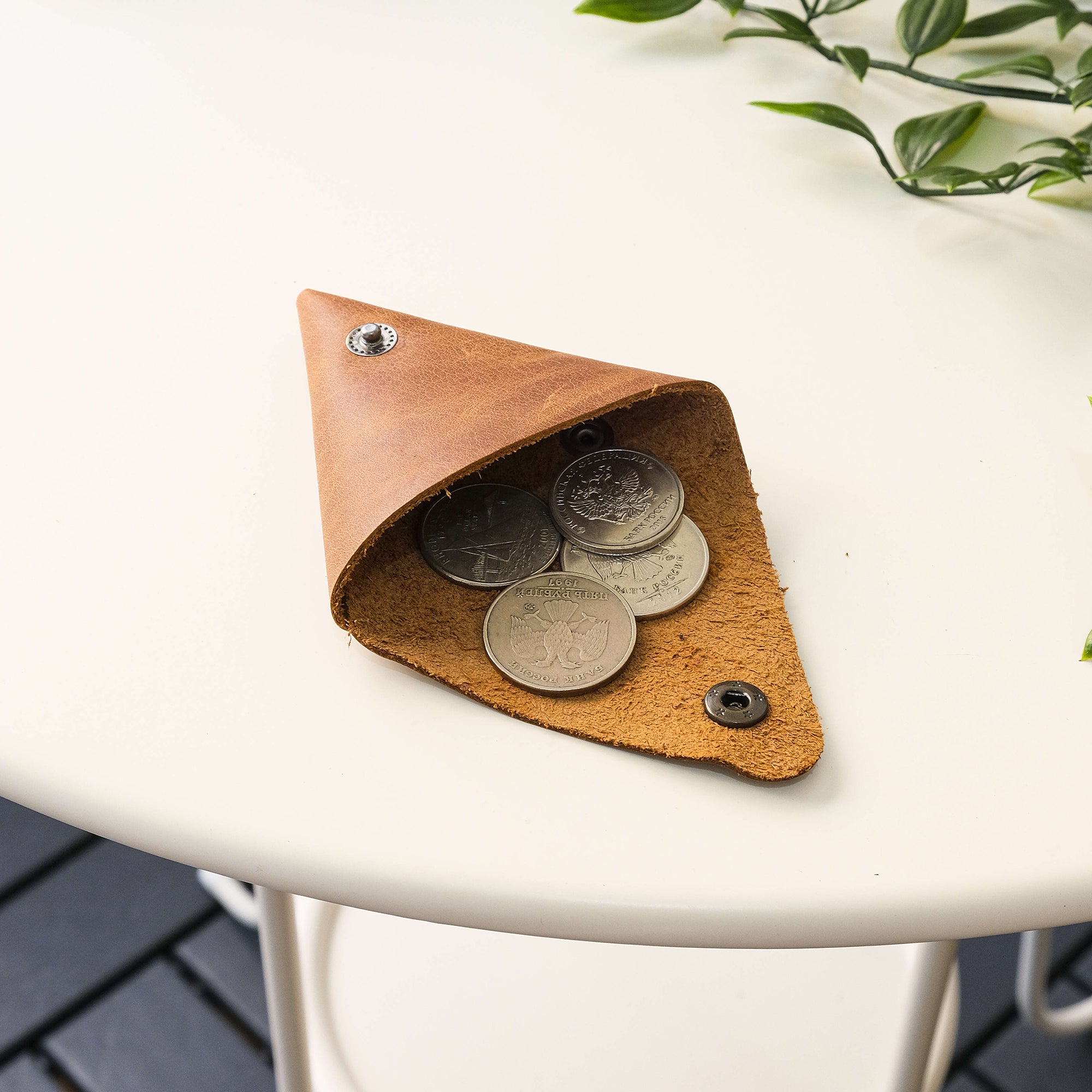 Bamby Genuine Leather Coin Pouch in various colors, showcasing its minimalist and stitchless design.