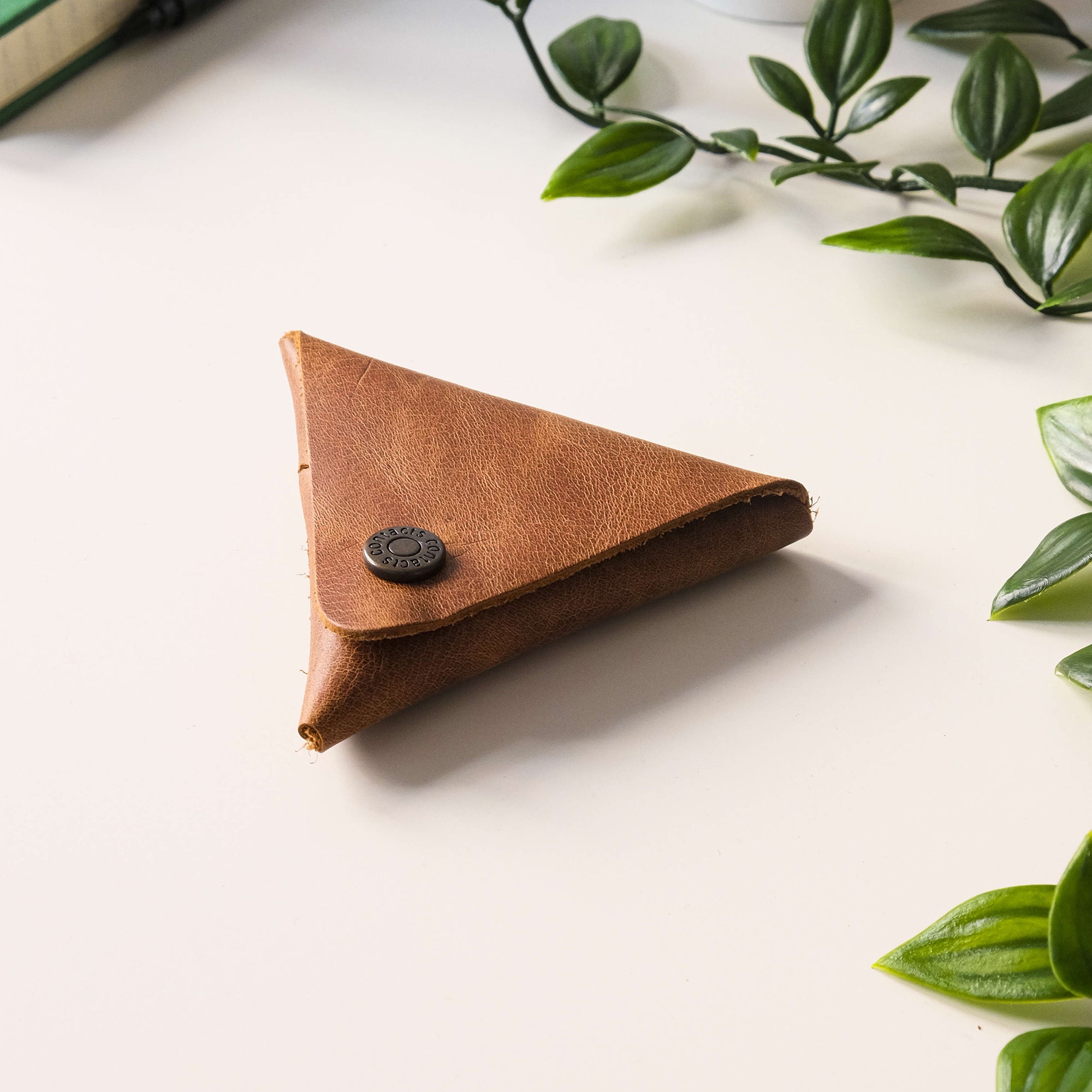 Bamby Genuine Leather Coin Pouch in various colors, showcasing its minimalist and stitchless design.