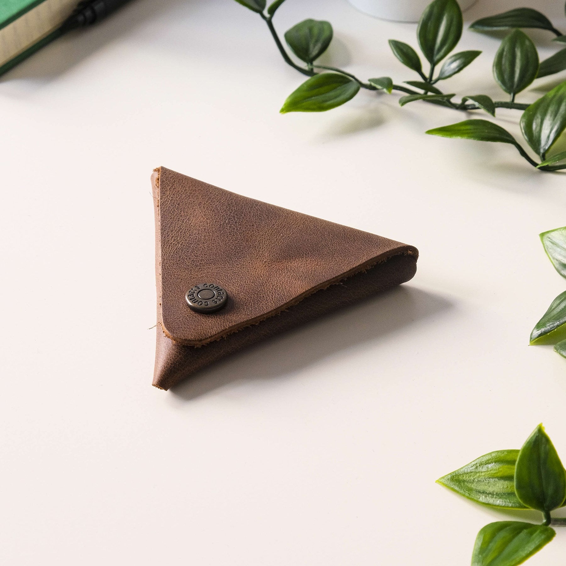 Bamby Genuine Leather Coin Pouch in various colors, showcasing its minimalist and stitchless design.