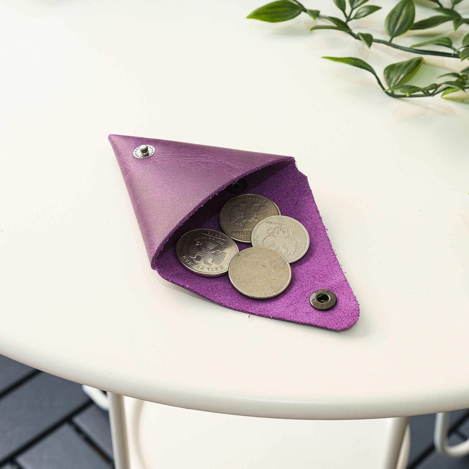 Bamby Genuine Leather Coin Pouch in various colors, showcasing its minimalist and stitchless design.