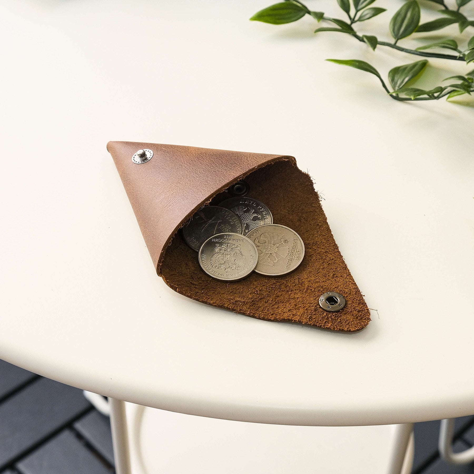 Bamby Genuine Leather Coin Pouch in various colors, showcasing its minimalist and stitchless design.