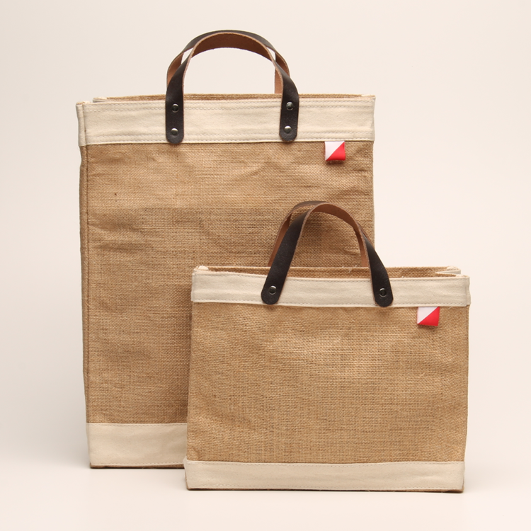 Bazaar Jute and Leather Tote Bag featuring eco-friendly jute, leather handles, and a stylish golden fabric design.