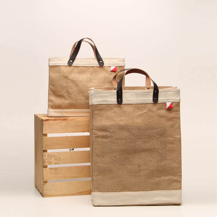 Bazaar Jute and Leather Tote Bag featuring eco-friendly jute, leather handles, and a stylish golden fabric design.