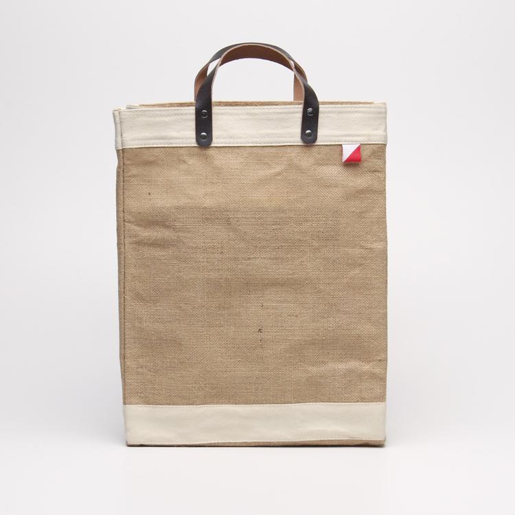 Bazaar Jute and Leather Tote Bag featuring eco-friendly jute, leather handles, and a stylish golden fabric design.