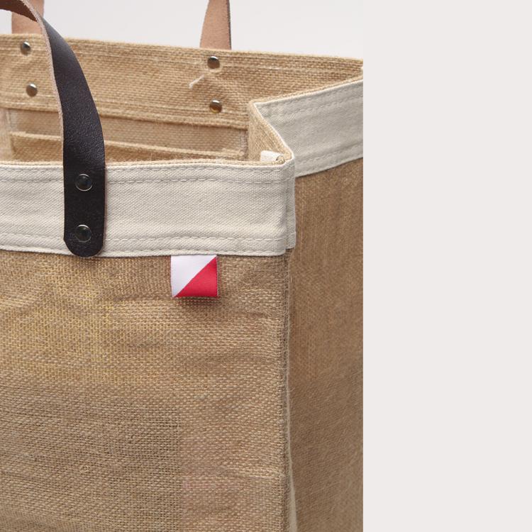 Bazaar Jute and Leather Tote Bag featuring eco-friendly jute, leather handles, and a stylish golden fabric design.