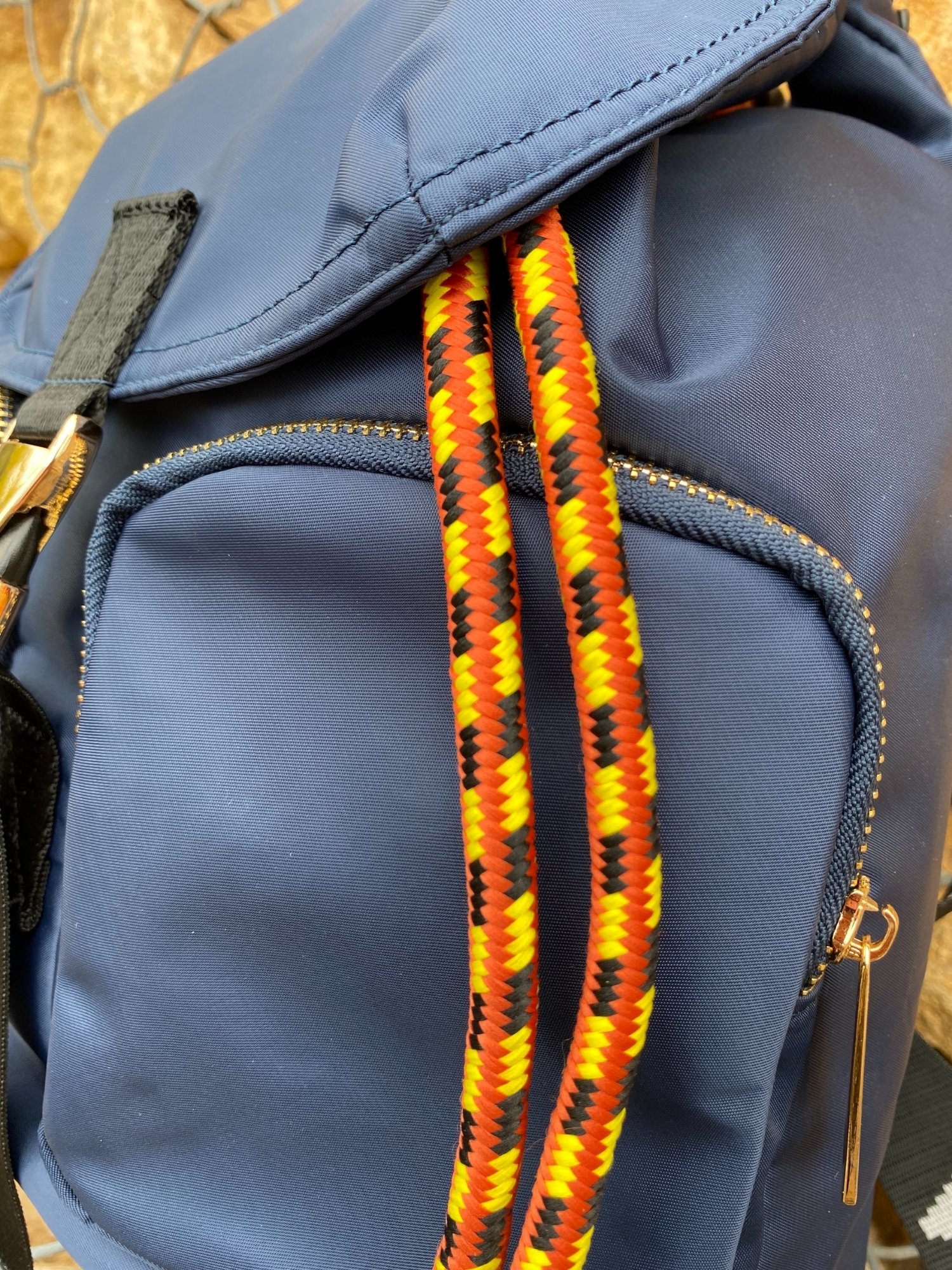 Belted Blue Backpack featuring shiny gold hardware and bright belt accent, perfect for daily use and adventures.