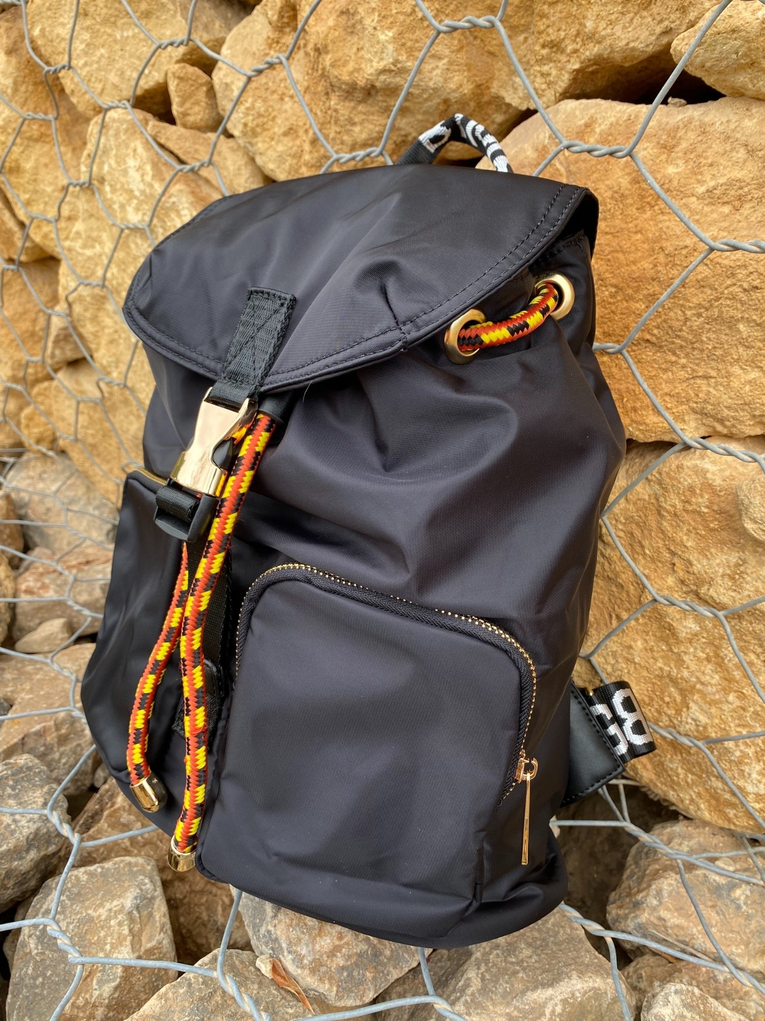 Belted Blue Backpack featuring shiny gold hardware and bright belt accent, perfect for daily use and adventures.