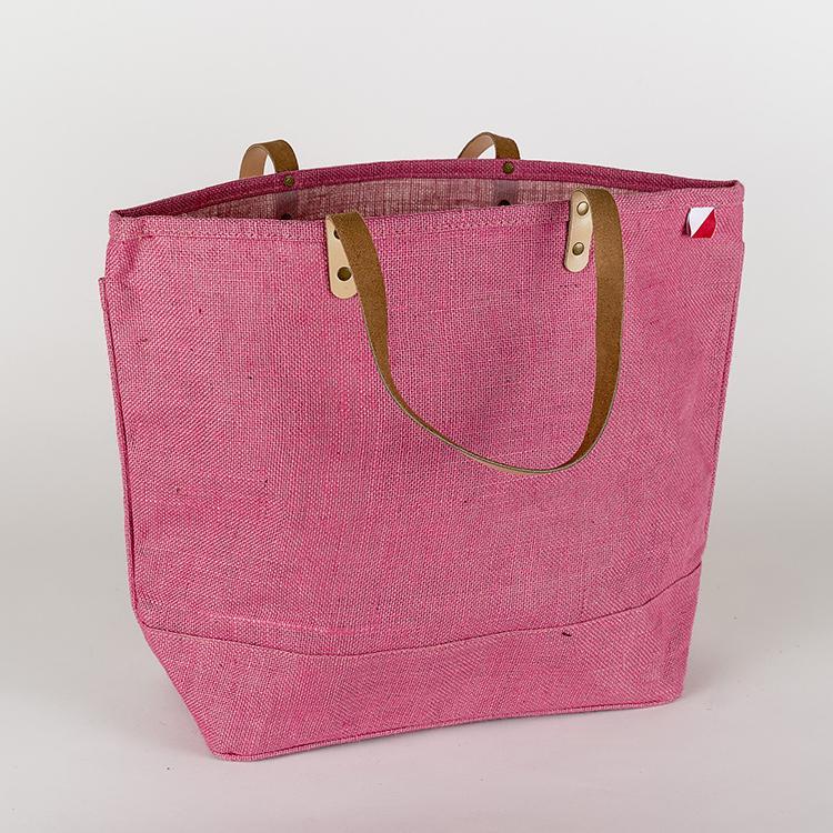 A vibrant Big Jute Colored Tote Bag with leather handles, showcasing its spacious interior and stylish design, perfect for errands and outings.