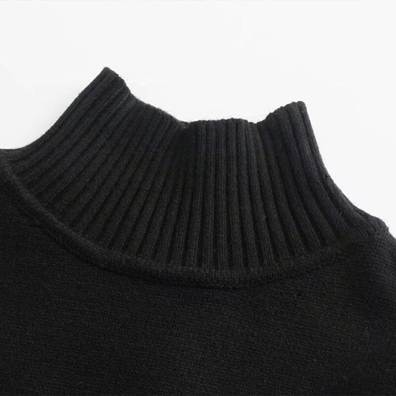 A stylish black and white striped knitted sweater with a turtleneck, perfect for autumn and winter wear.