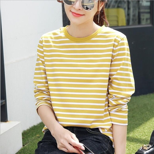 A stylish black and white striped shirt for women, featuring a loose fit and full sleeves, perfect for casual spring and autumn wear.