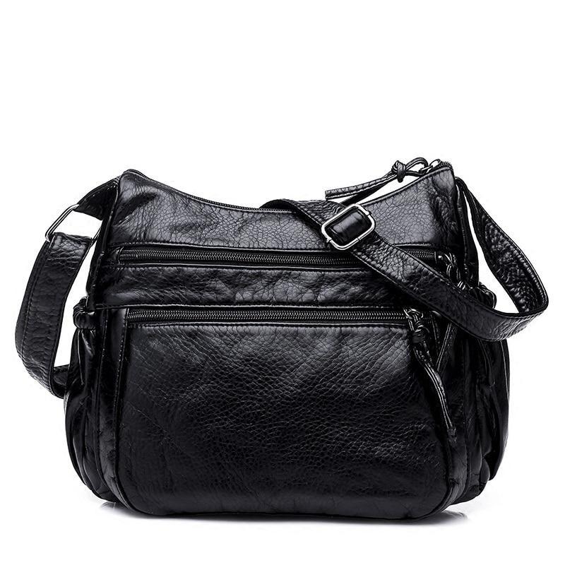 Black PU leather messenger bag for women, featuring a sleek design and spacious interior, perfect for everyday use.