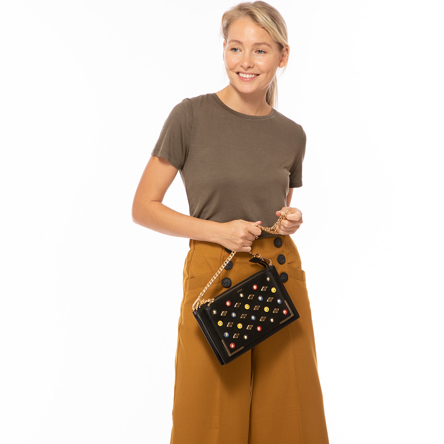 Black Studded Crossbody Clutch with gold chain and leather straps, featuring a chic square silhouette and zipped pockets.