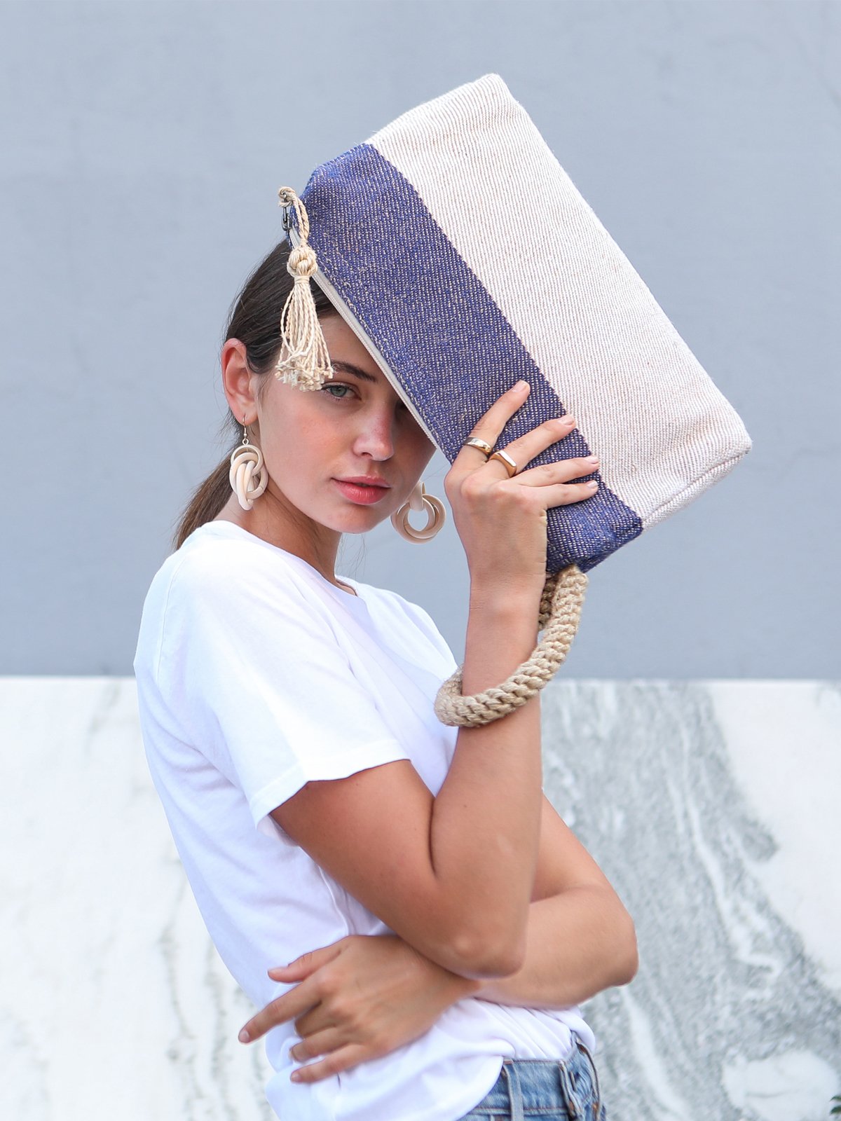 Block A Clutch in Blue with macrame handle, showcasing its spacious design and vibrant color.