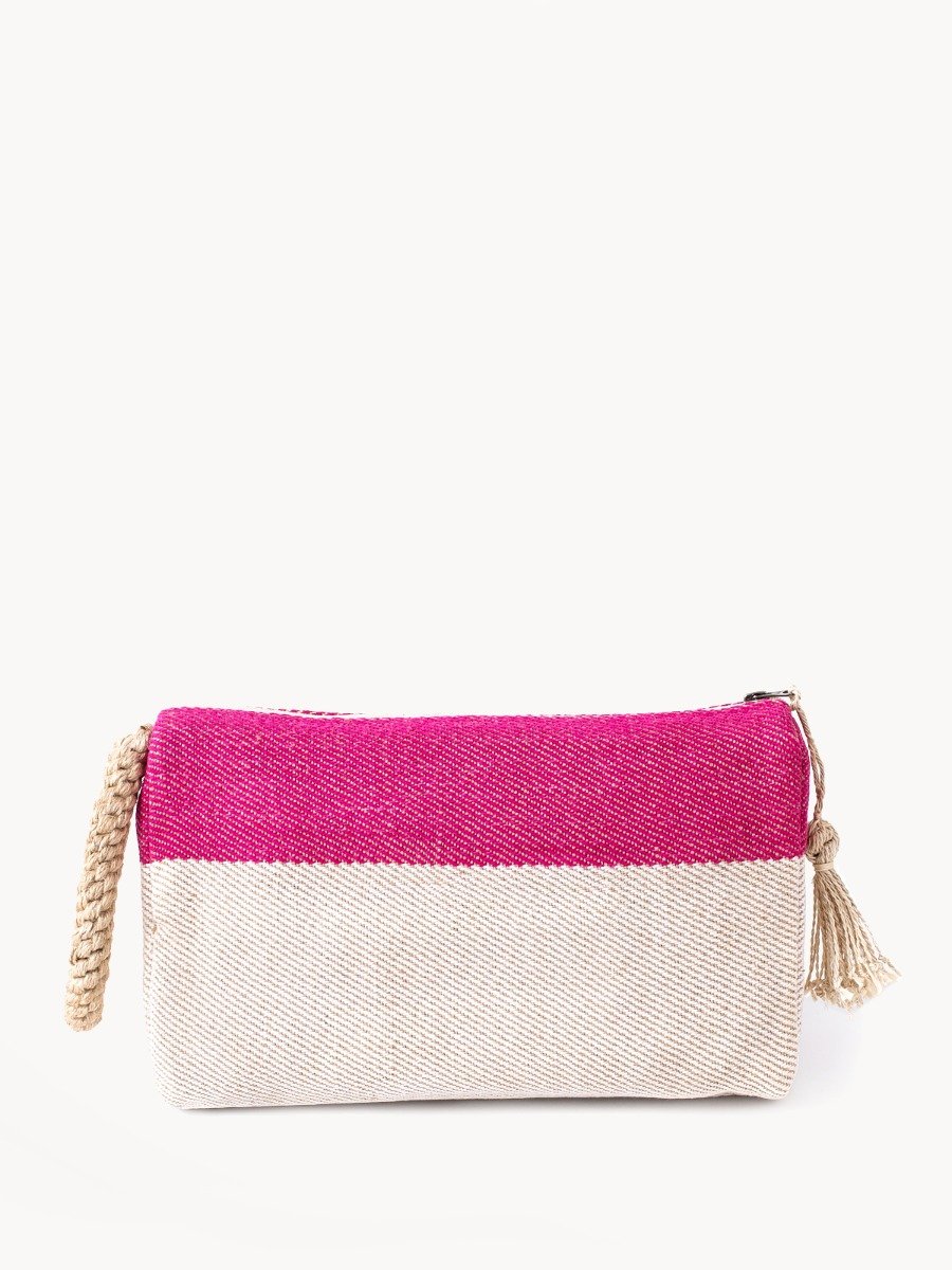 Block A Clutch in Pink with oversized macrame handle, showcasing its jute-cotton fabric and zipper enclosure.