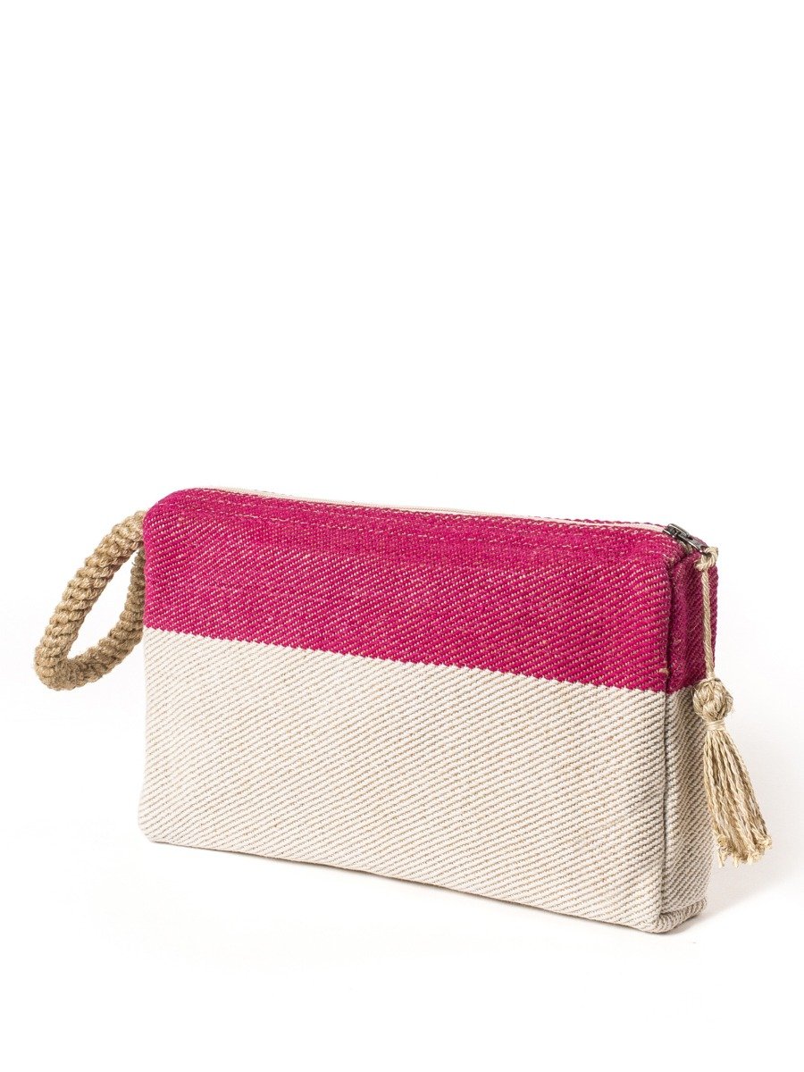 Block A Clutch in Pink with oversized macrame handle, showcasing its jute-cotton fabric and zipper enclosure.