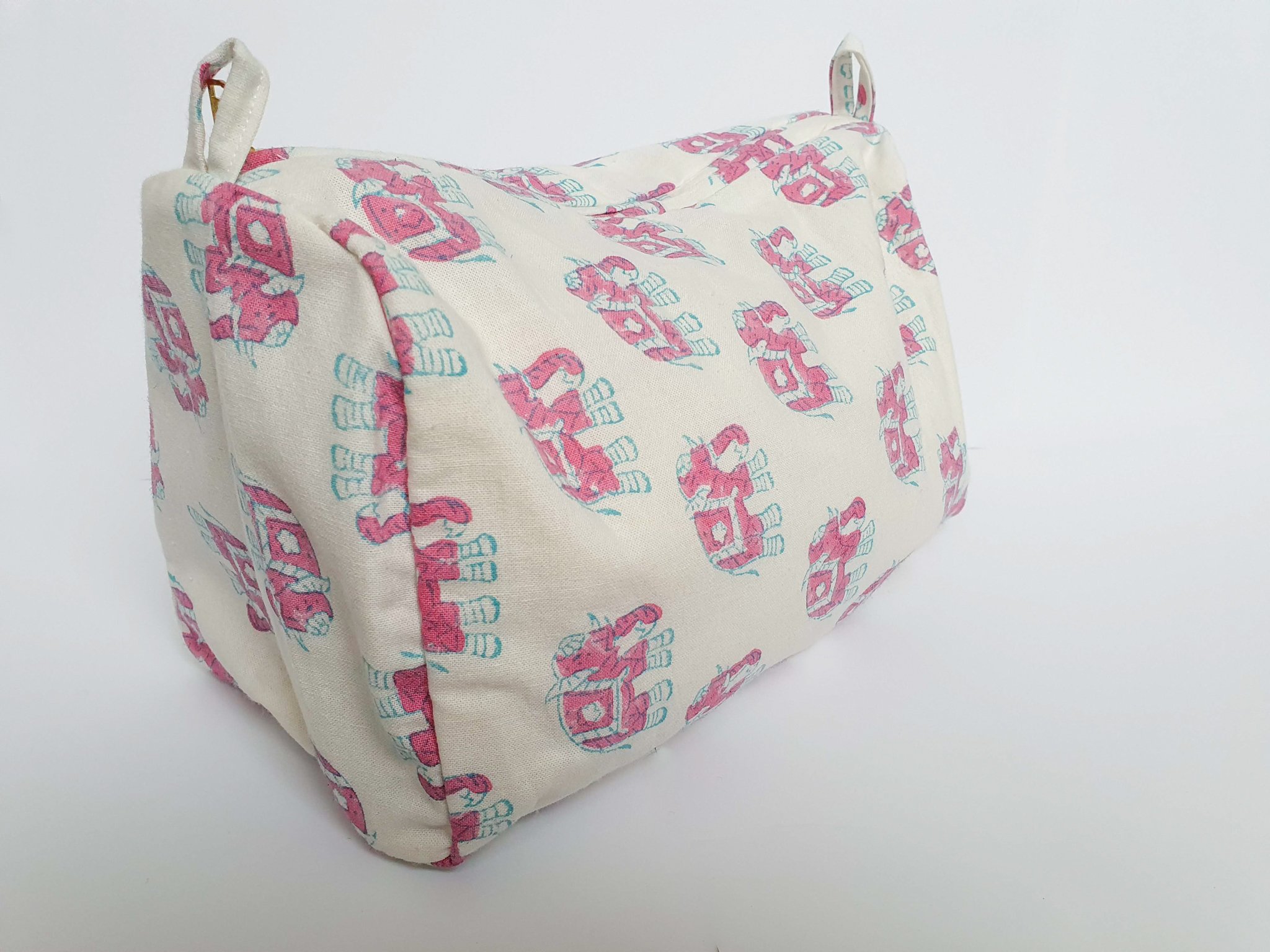 A colorful block-printed elephant toiletry bag featuring vibrant elephants on a cotton fabric, perfect for travel and organization.