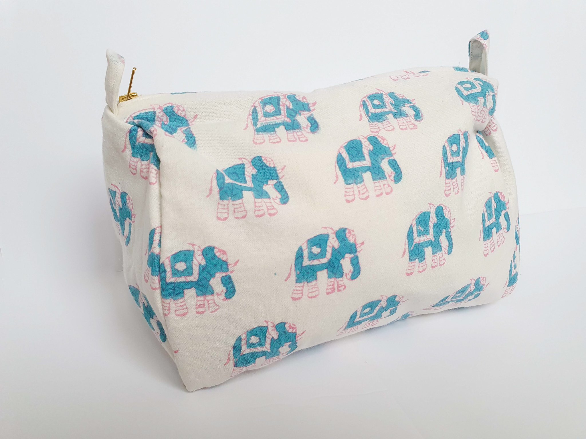 A colorful block-printed elephant toiletry bag featuring vibrant elephants on a cotton fabric, perfect for travel and organization.