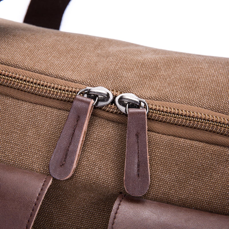 A versatile medium-sized canvas travel bag suitable for both genders, featuring a waterproof design and double straps for comfort.