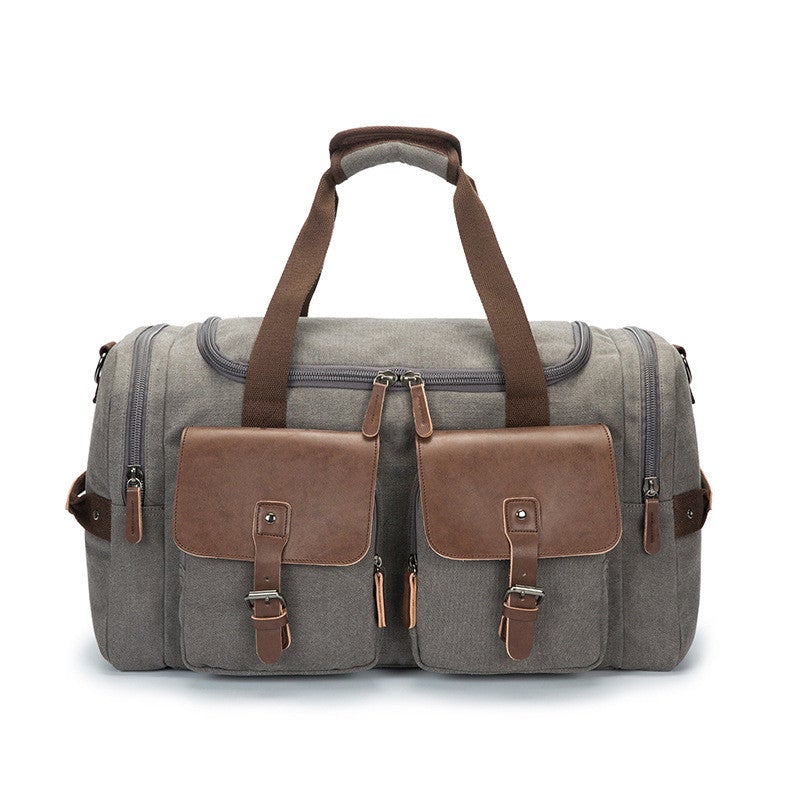 A versatile medium-sized canvas travel bag suitable for both genders, featuring a waterproof design and double straps for comfort.