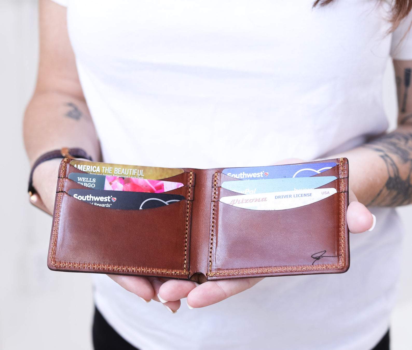 Bowman Bifold Wallet made from genuine full grain leather, featuring a classic design with personalization option.