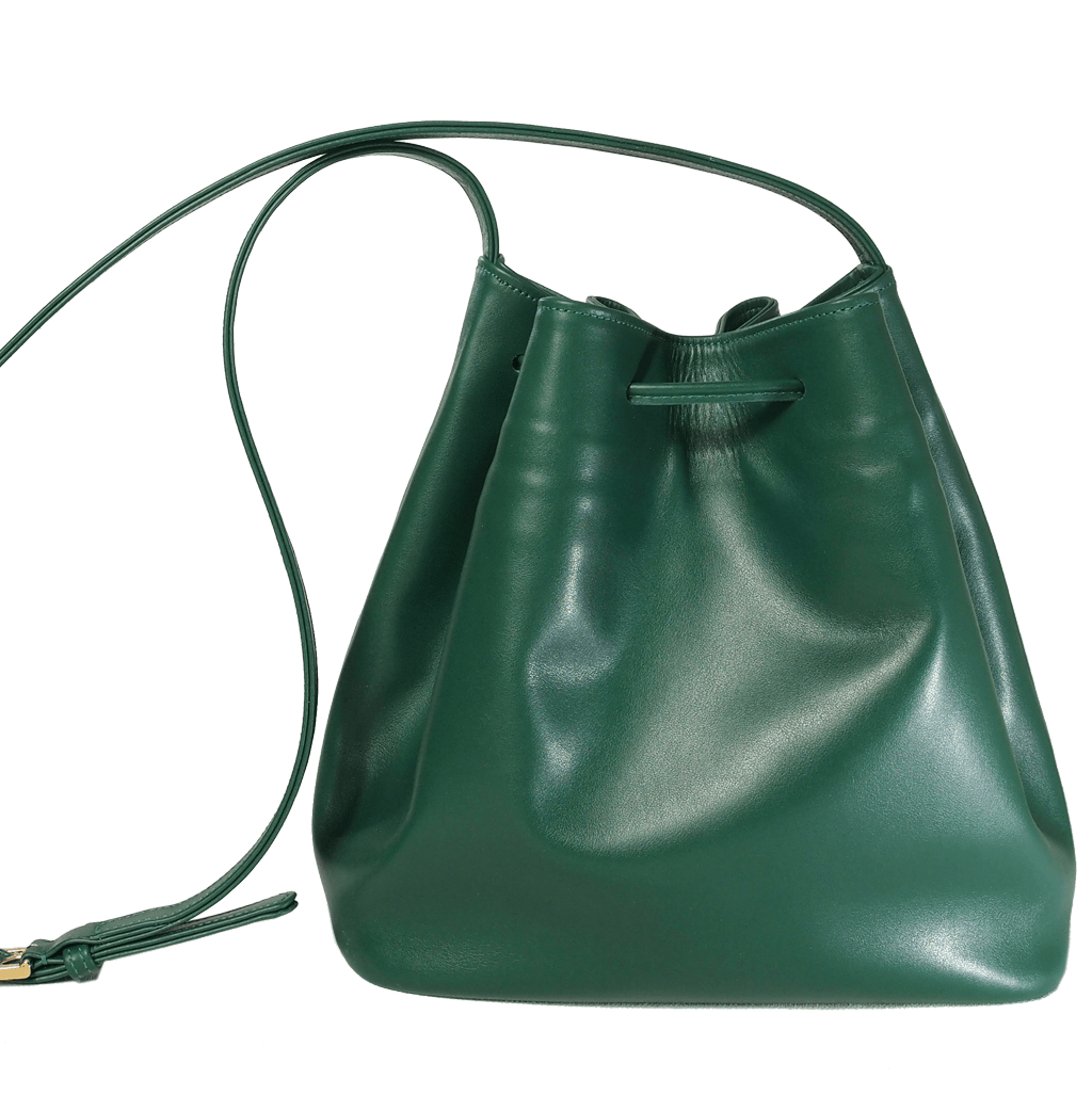 Emerald-green buffed leather bucket bag with fringed straps and gold studs, showcasing a spacious cotton interior and elegant design.