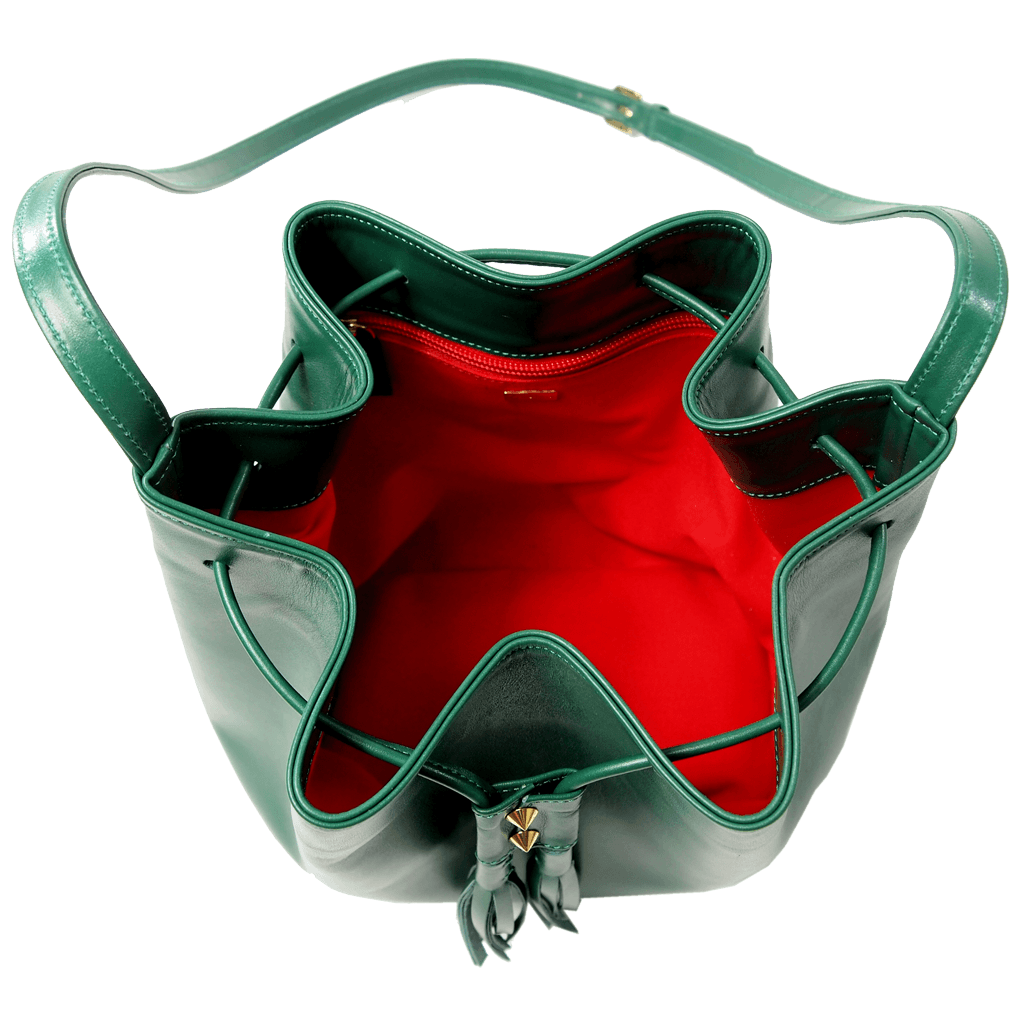 Emerald-green buffed leather bucket bag with fringed straps and gold studs, showcasing a spacious cotton interior and elegant design.