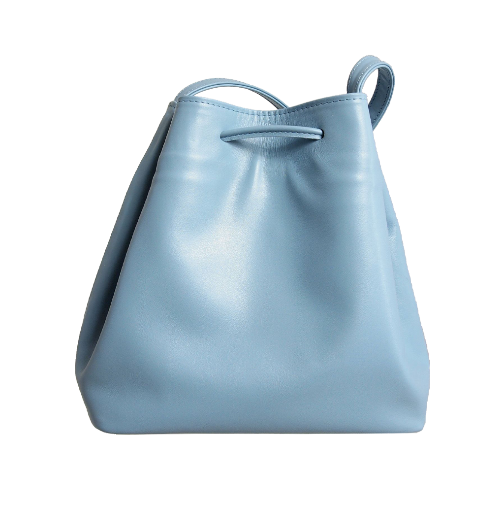 Sky-blue buffed leather bucket bag with fringed straps and gold studs, featuring a spacious cotton interior and zipped compartment.