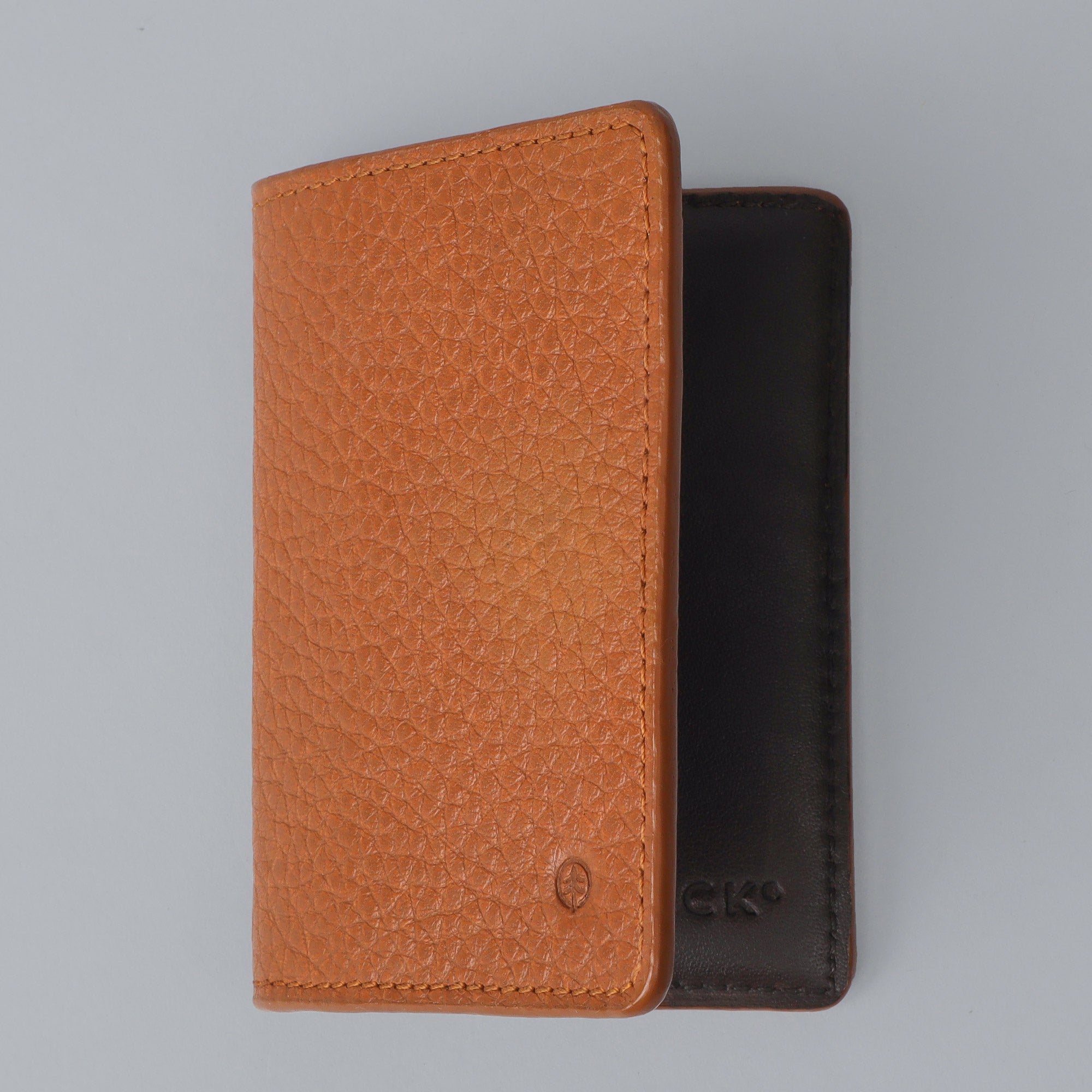 A stylish Business Cards Leather Wallet made from premium full grain leather, featuring multiple pockets for business cards and a sleek design.